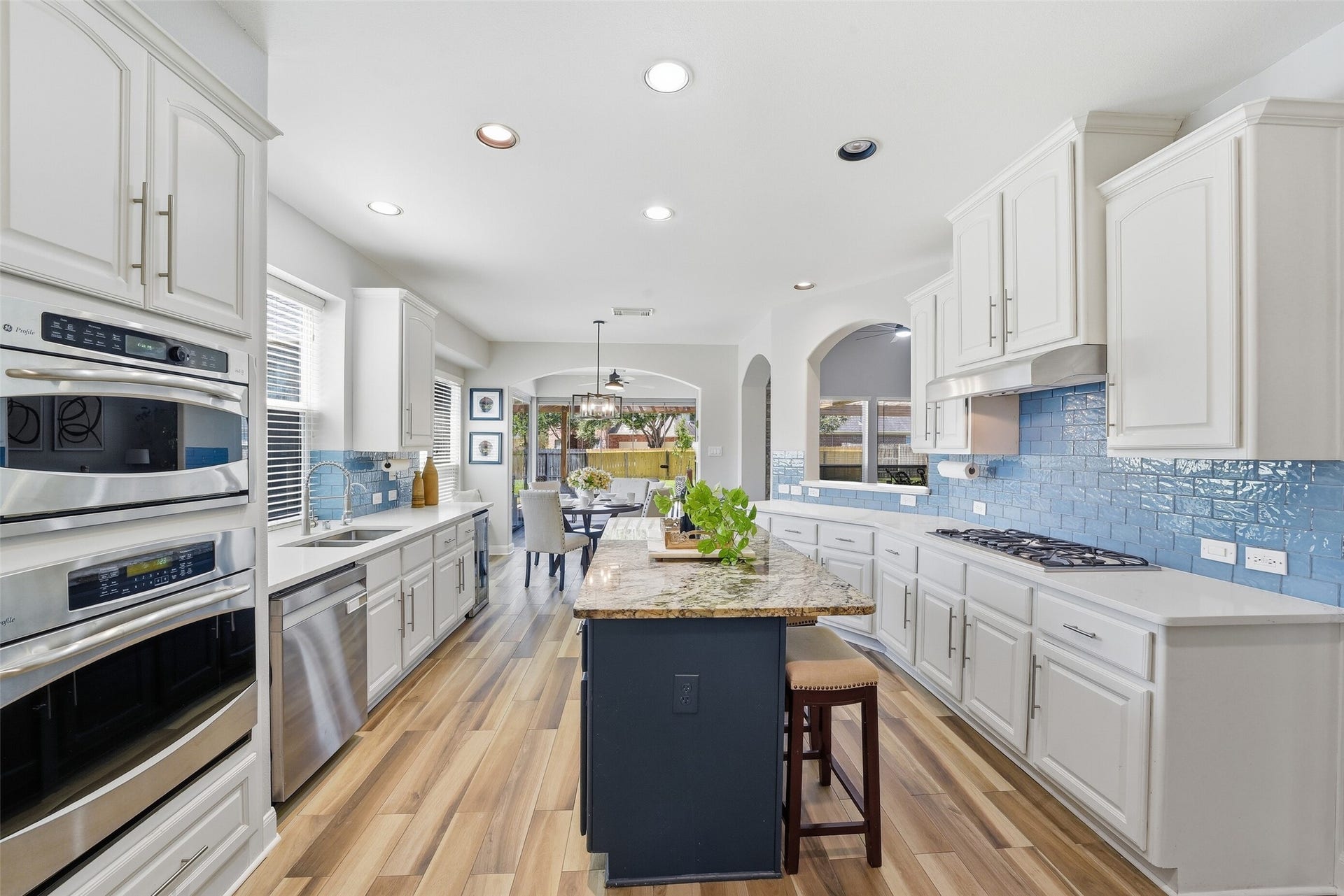 2710 Golden Larch Drive, Katy, TX 77494 Updated countertops and backsplash give the kitchen a fresh look.