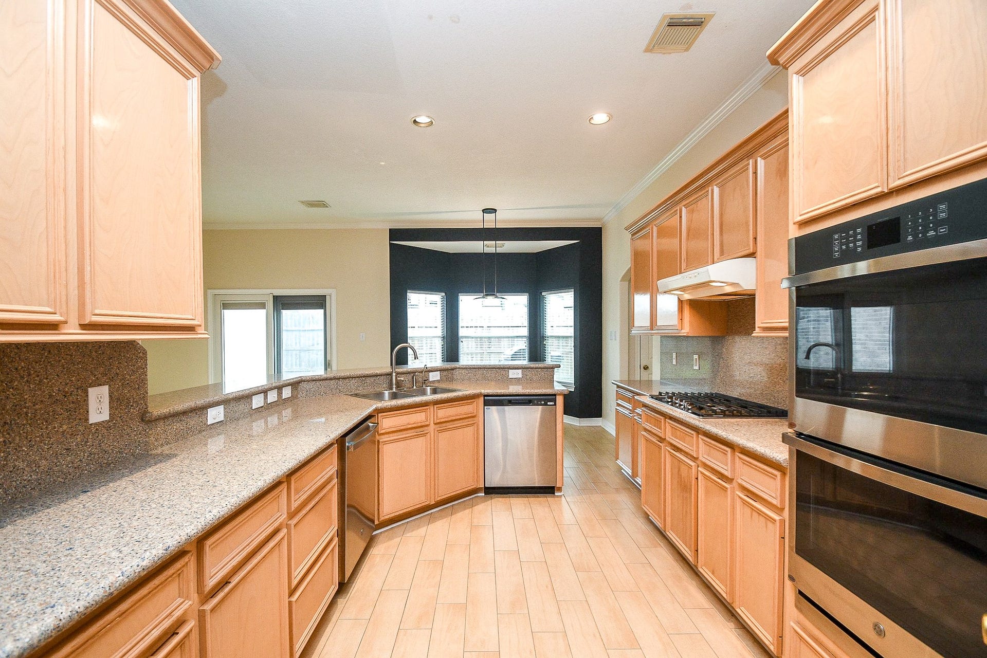 Spacious kitchen with ample natural light.