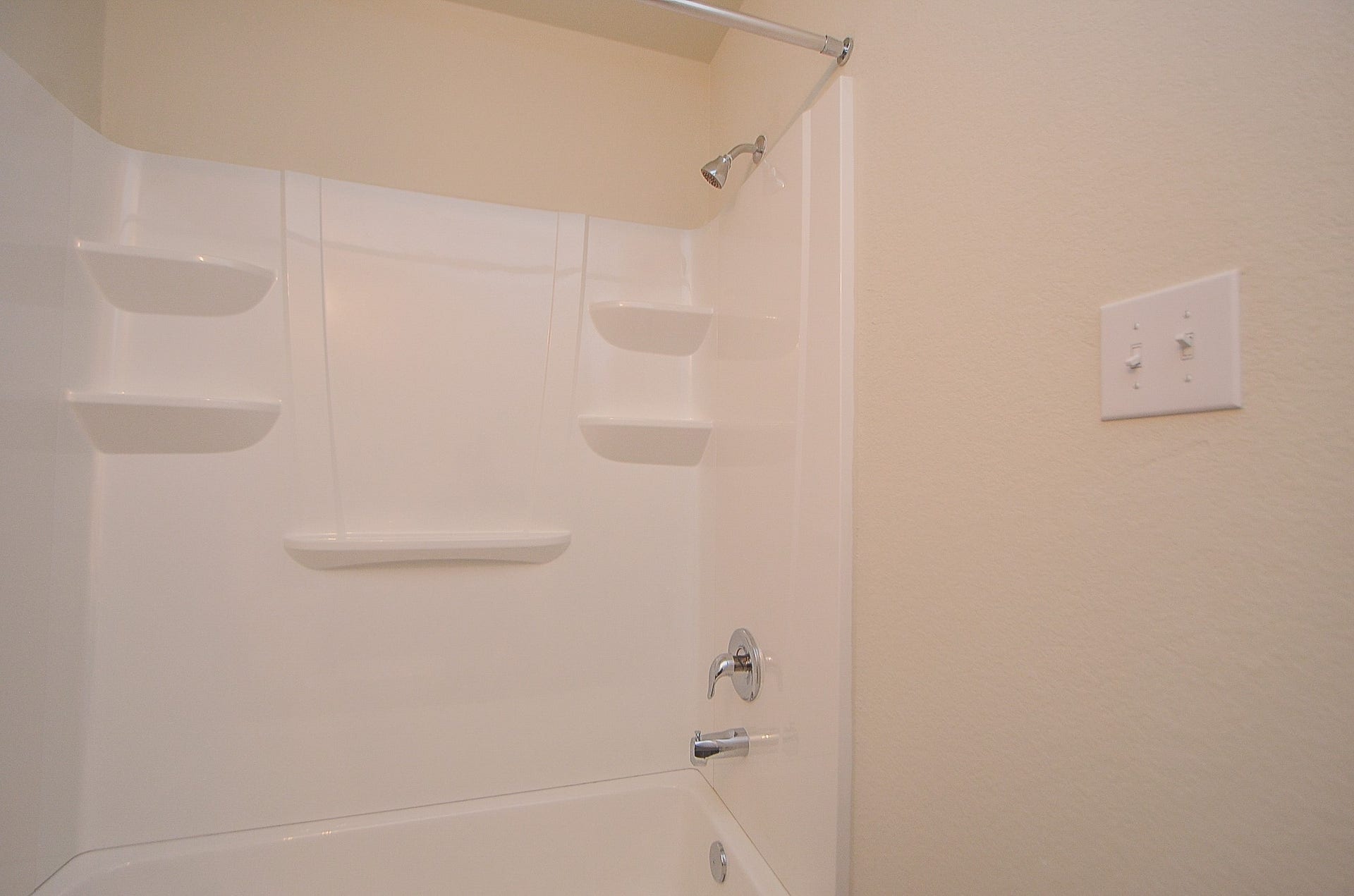 Hall bath w/ tub/shower surround.