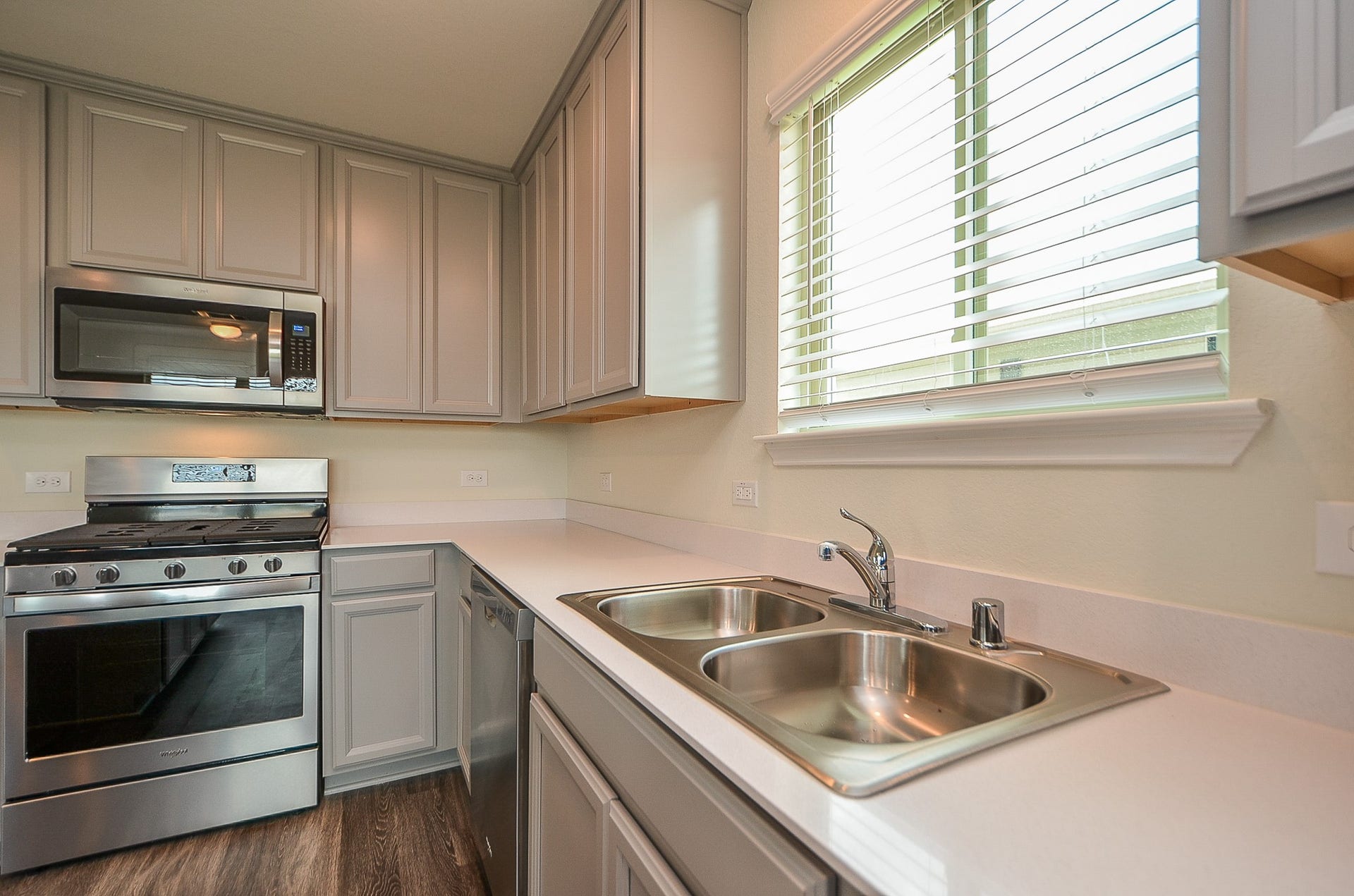 Stainless steel Whirlpool appliance package includes gas range, built-in microwave, dishwasher & fridge!