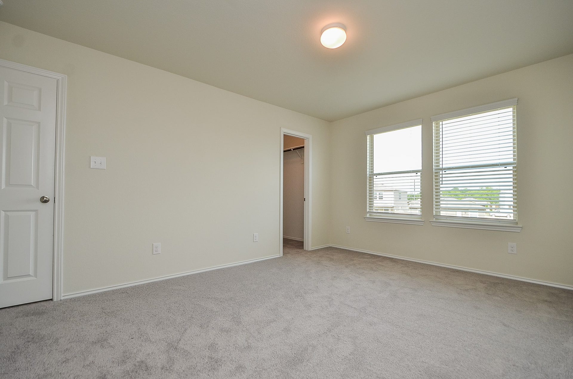 Primary bedroom is light & bright and all rooms have blinds!