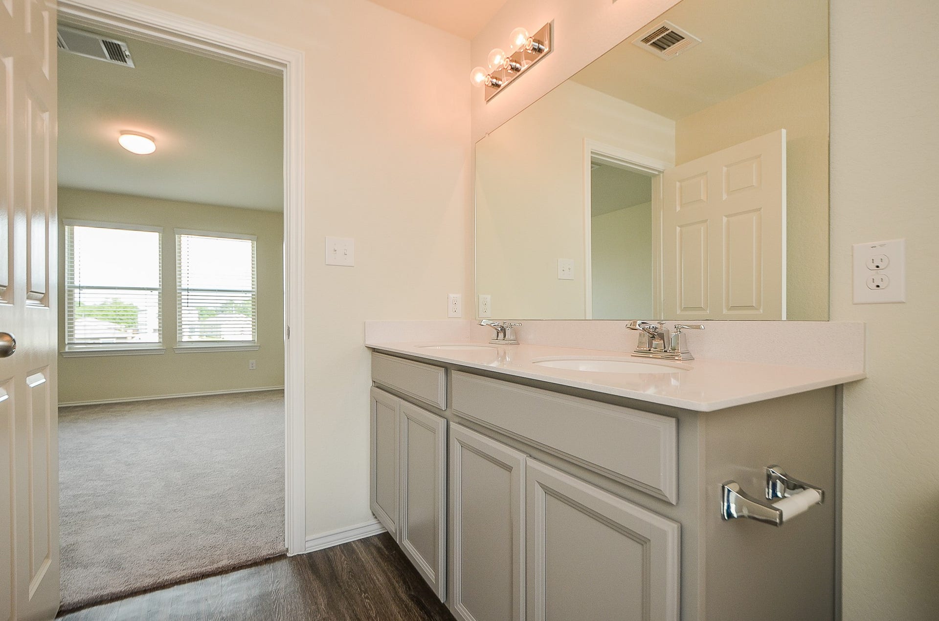 Vinyl floors in the primary bathroom (water-resistant) & gorgeous granite countertops.