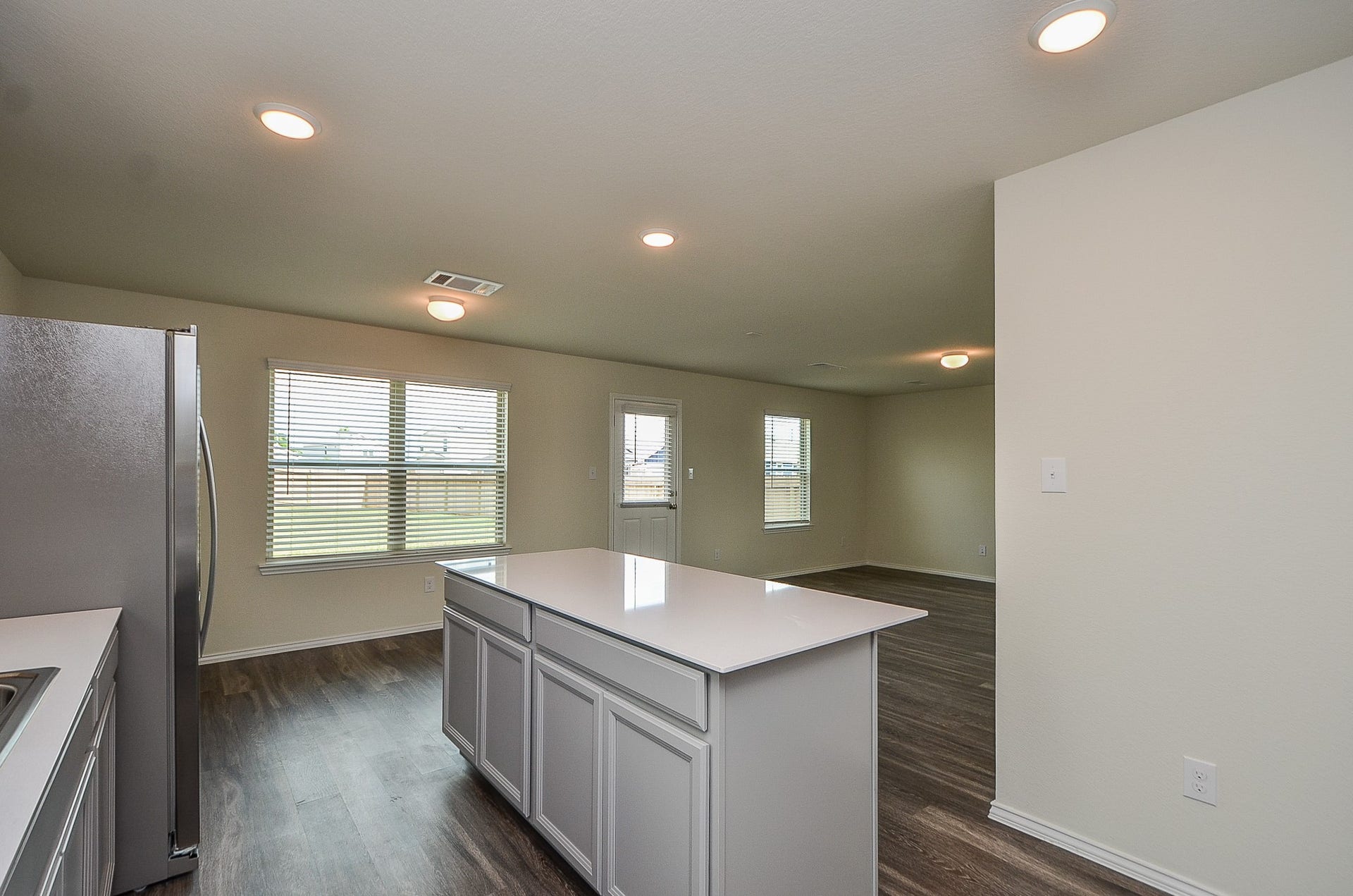 Dining room is next to kitchen for your serving ease. Or sit at the island!