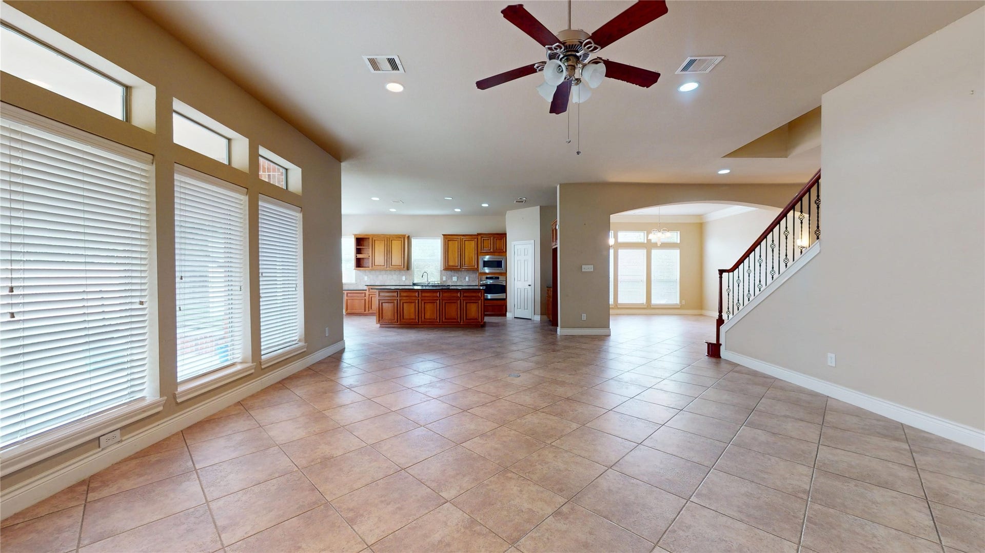 3502 Urban Woods Trail, Houston, TX 77008 View of the kitchen and formal dining from the den...the entire first floor living space is tiled, with the exception of the study, which has laminate flooring, and the closet, which is carpeted.