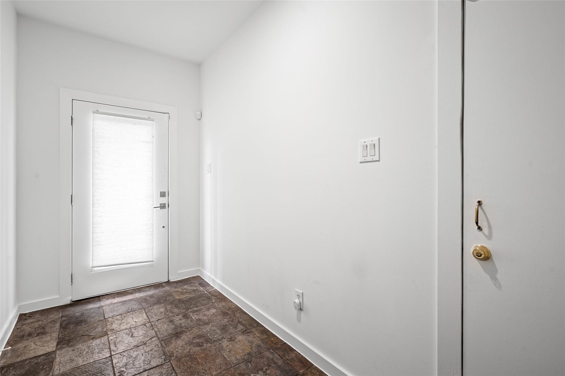 5712 Winsome Lane, #5, Houston, TX 77057 Elegant glass-paneled door that adds a touch of sophistication while allowing natural light to flow inside.