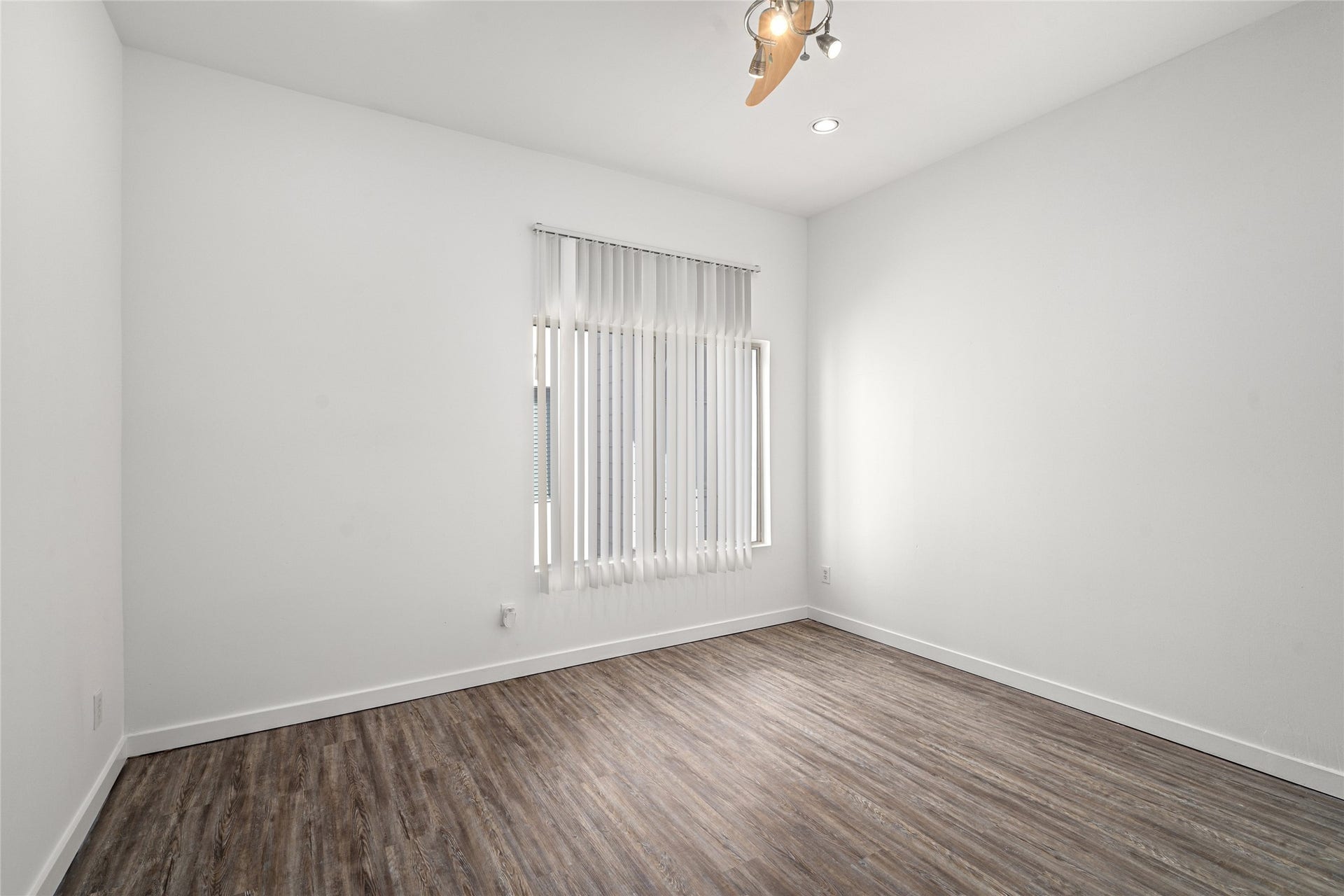 5712 Winsome Lane, #5, Houston, TX 77057 Serene primary bedroom offering ample space for relaxation, featuring large windows that invite natural light and a peaceful atmosphere to unwind after a long day.