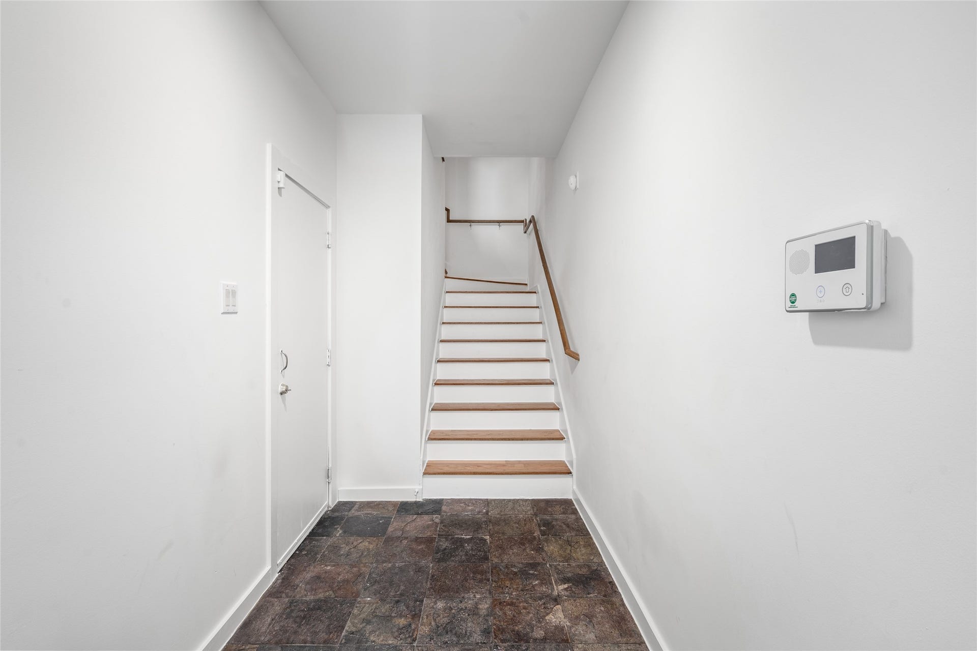 5712 Winsome Lane, #5, Houston, TX 77057 Bright entryway featuring sleek stairs and easy access to upstairs treasures.
