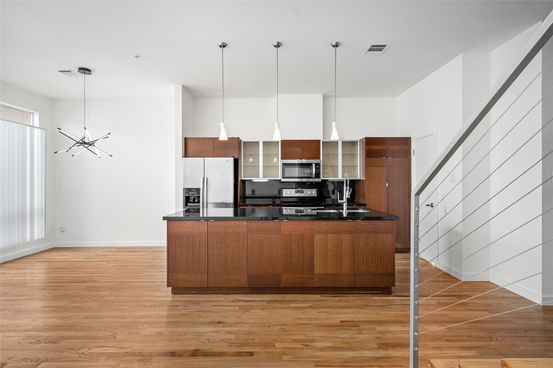 5712 Winsome Lane, #5, Houston, TX 77057 The open concept design keeps you engaged in every corner of the home, allowing you to stay connected to the kitchen, dining, and living areas, perfect for a social and functional flow.