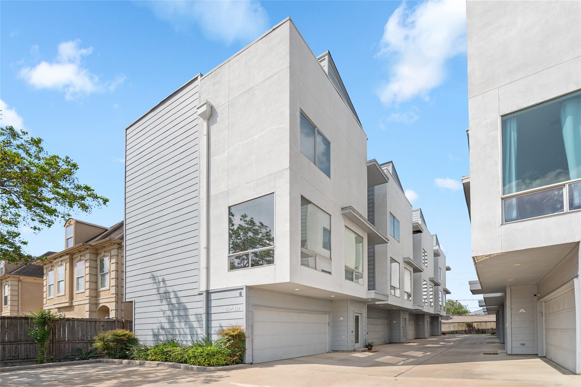 5712 Winsome Lane, #5, Houston, TX 77057 Modern three-story townhome in a gated community. Sleek contemporary design with large windows for natural light and a spacious two-car garage. Prime location with a private and secure setting.