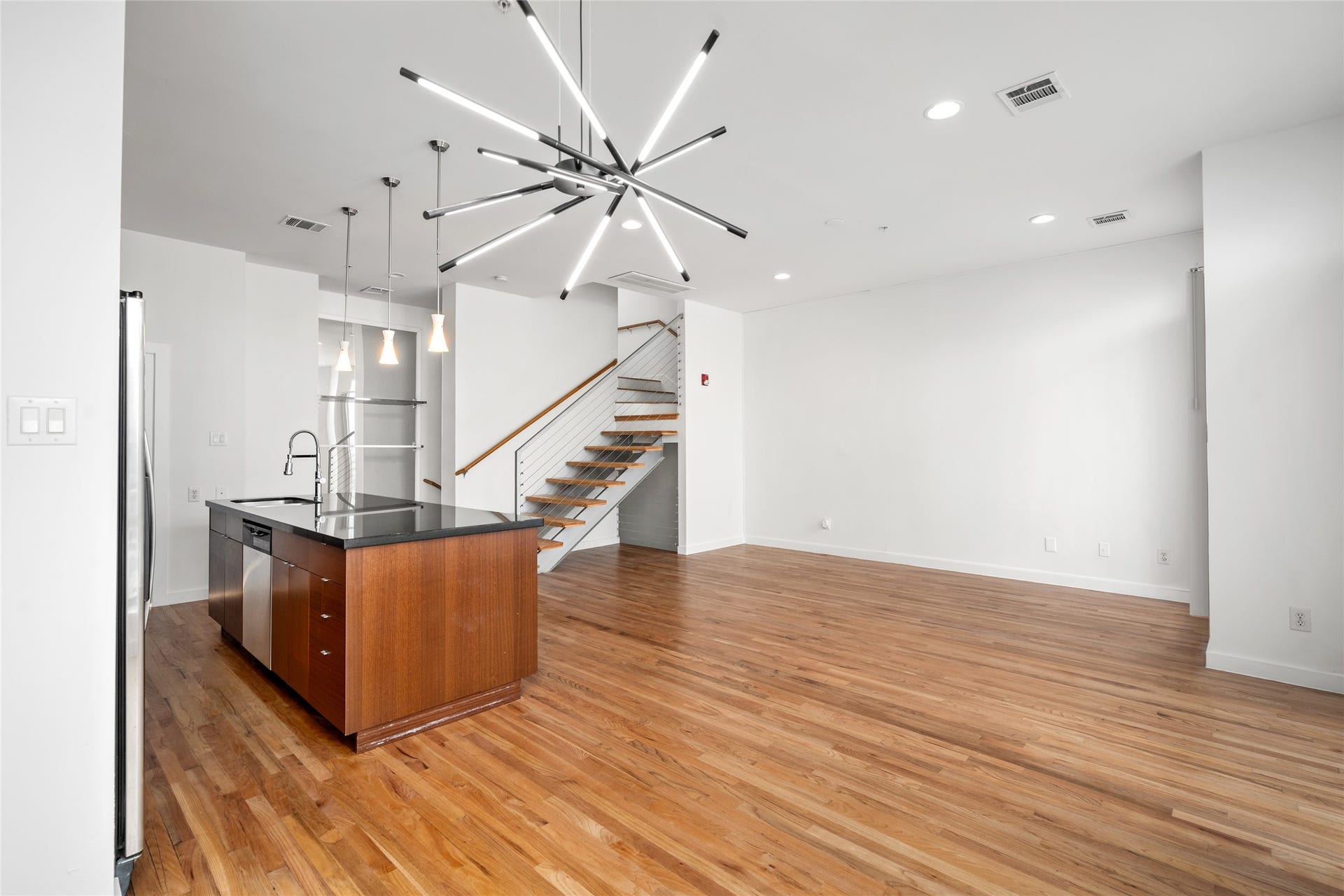 5712 Winsome Lane, #5, Houston, TX 77057 Open concept layout that seamlessly connects living, dining, and kitchen areas, creating a spacious and airy environment perfect for modern living and entertaining.