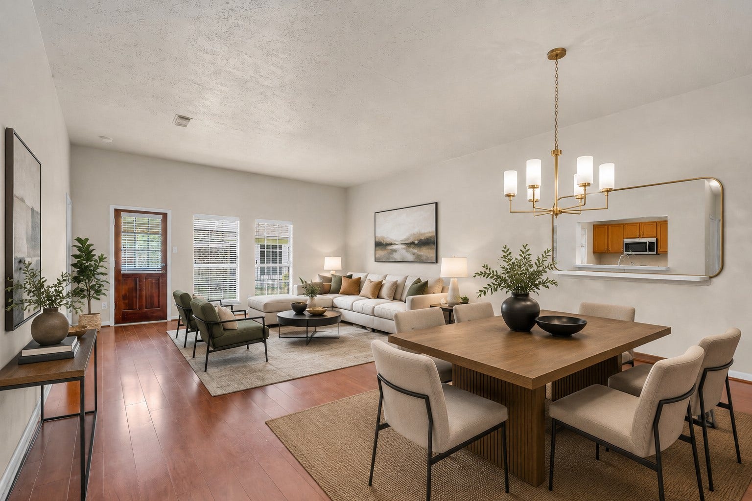 3310 Country Meadows Court, Pearland, TX 77584 The living room and dining area receive plenty of natural light through windows overlooking the backyard, creating a bright and airy feel throughout the space.