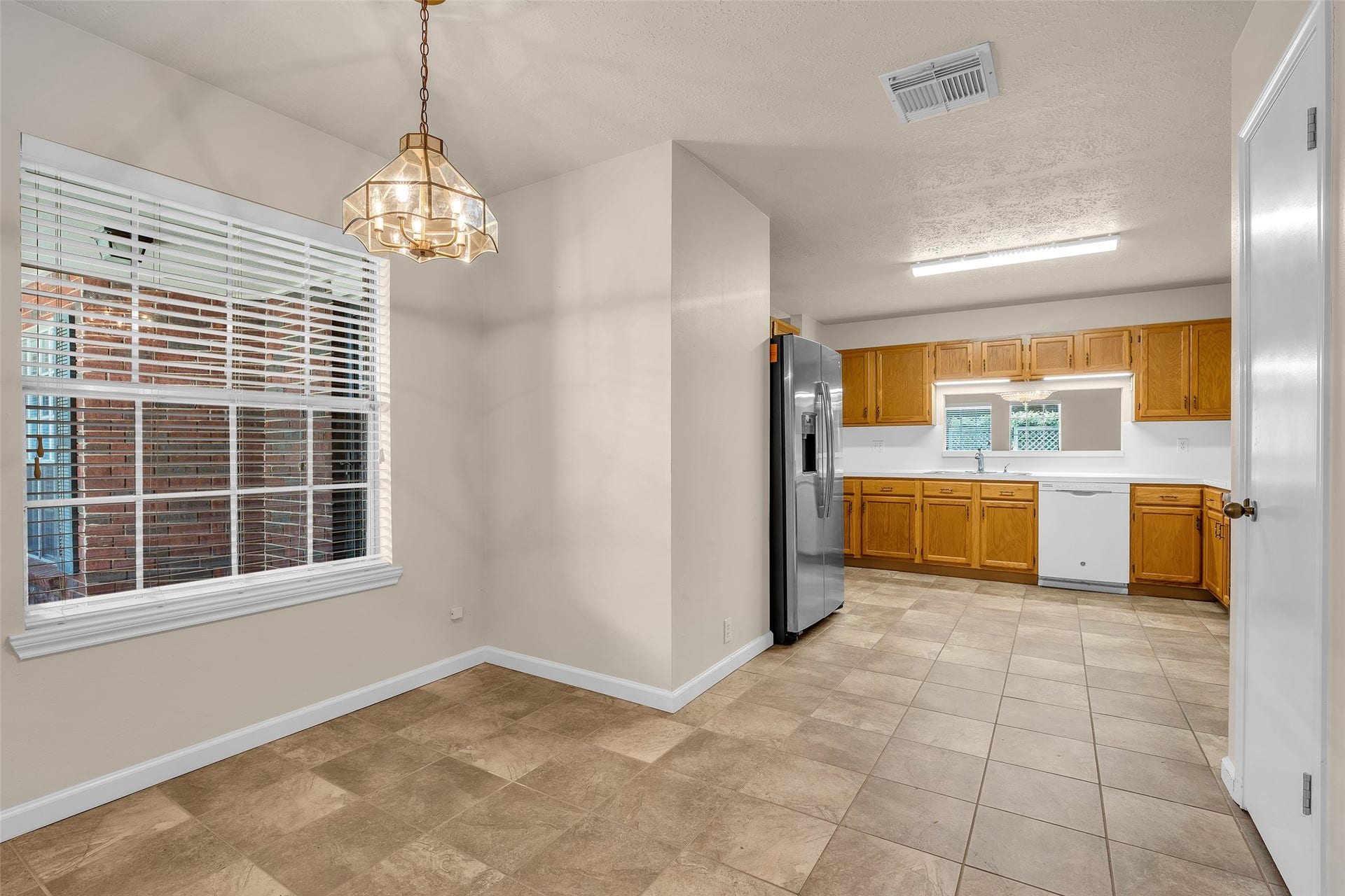 3310 Country Meadows Court, Pearland, TX 77584 The breakfast nook offers an open view that extends directly into the kitchen, creating a connected and functional layout.