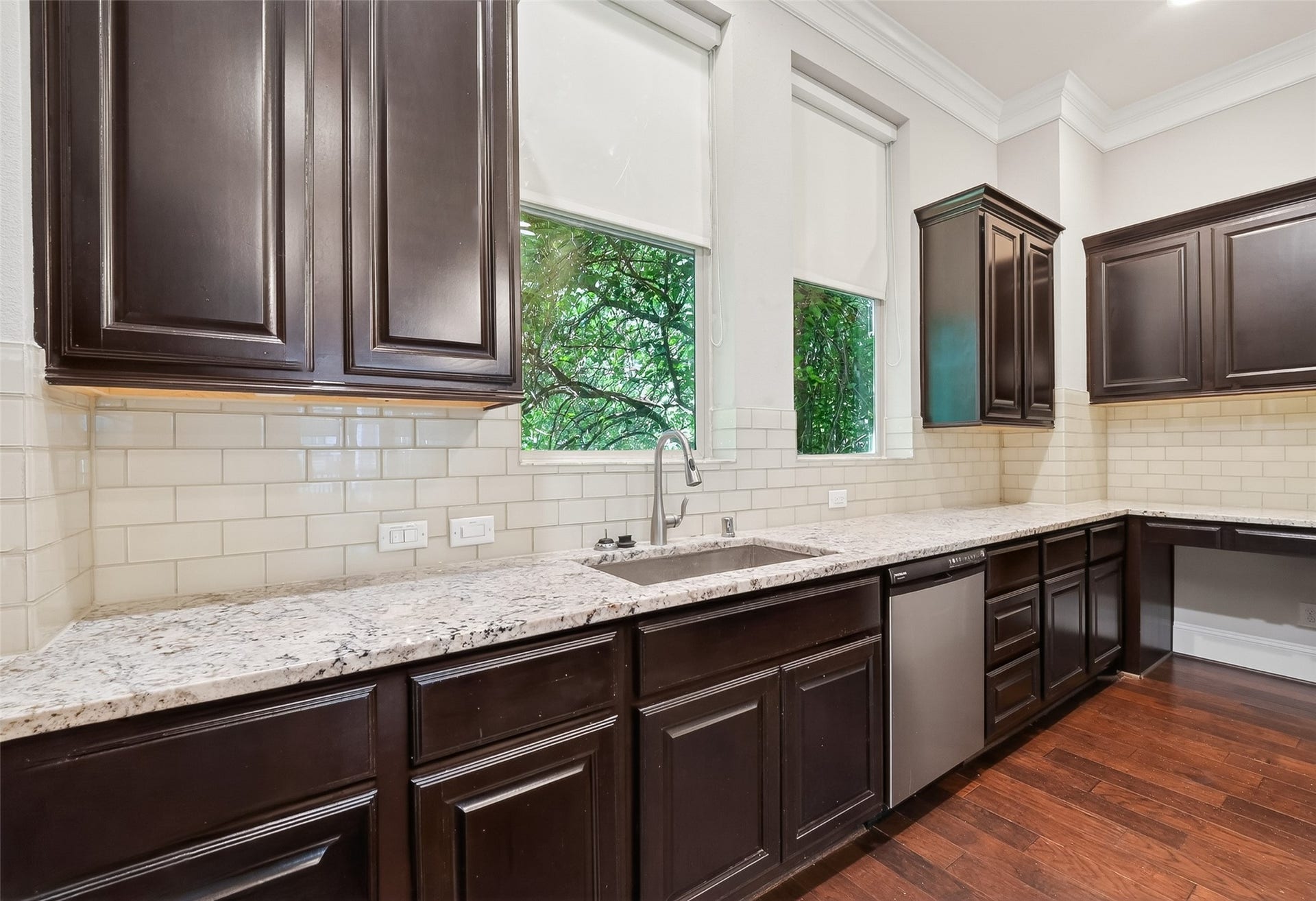 816 Yale Street, #C, Houston, TX 77007 The sleek subway tile backsplash offers a modern and elegant look.