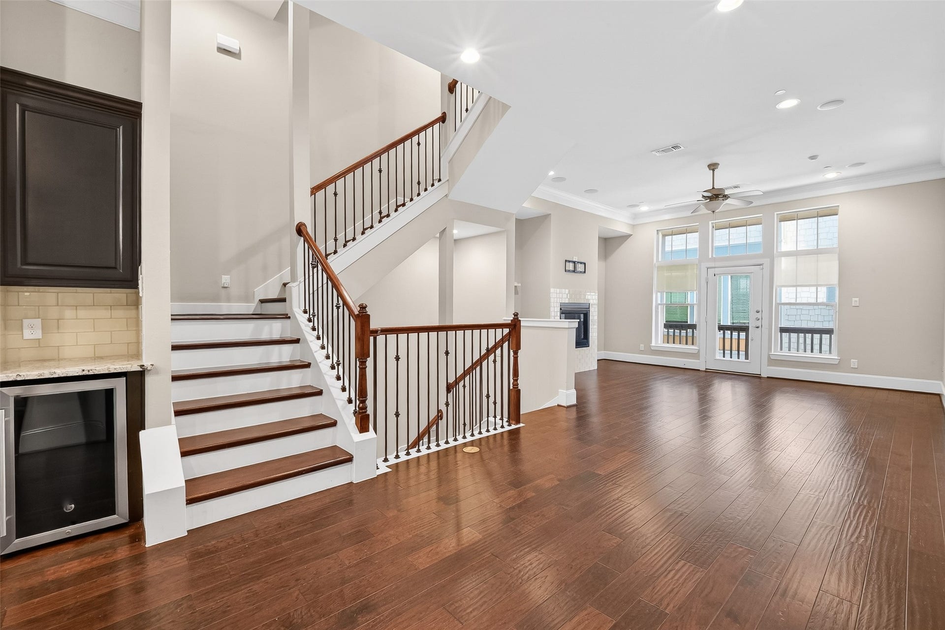 816 Yale Street, #C, Houston, TX 77007 Another view of the open-concept living space, note the beverage refrigerator next to the stairs.