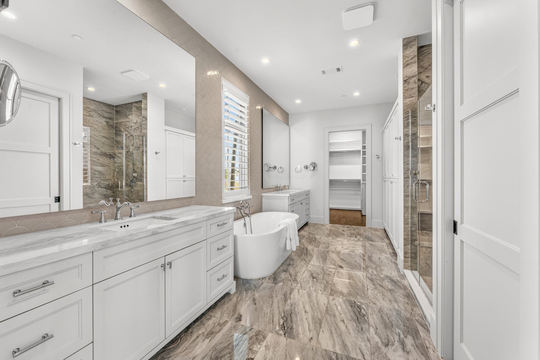 2328 Bissonnet Street, Houston, TX 77005 Relaxing soaking tub, large shower, and Toto Washlet. Also, convenient magnifying mirrors and outlet in bathroom drawer.