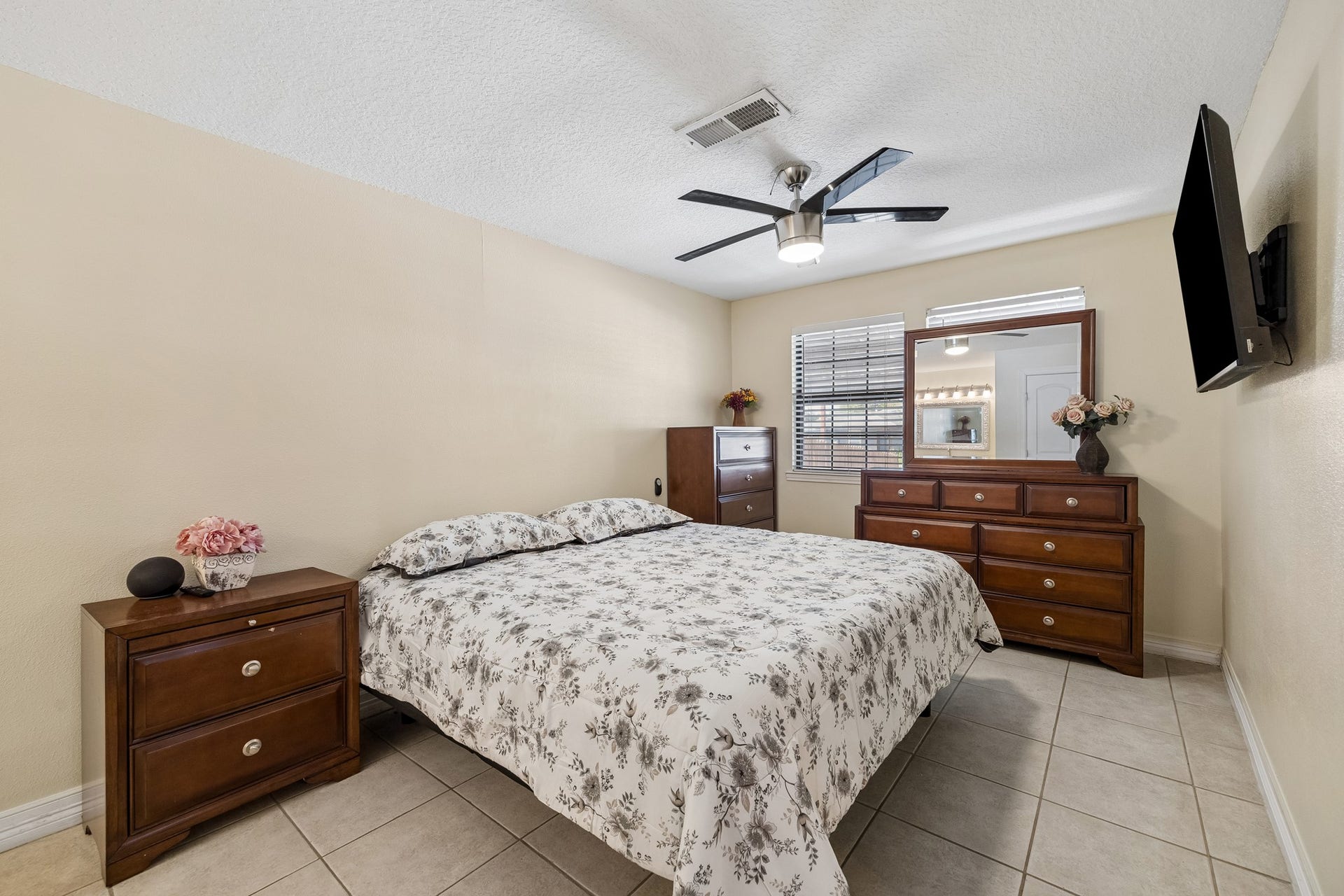 10702 Duncum Street, Houston, TX 77013 Large primary with tile throughout, creating a warm and inviting atmosphere.