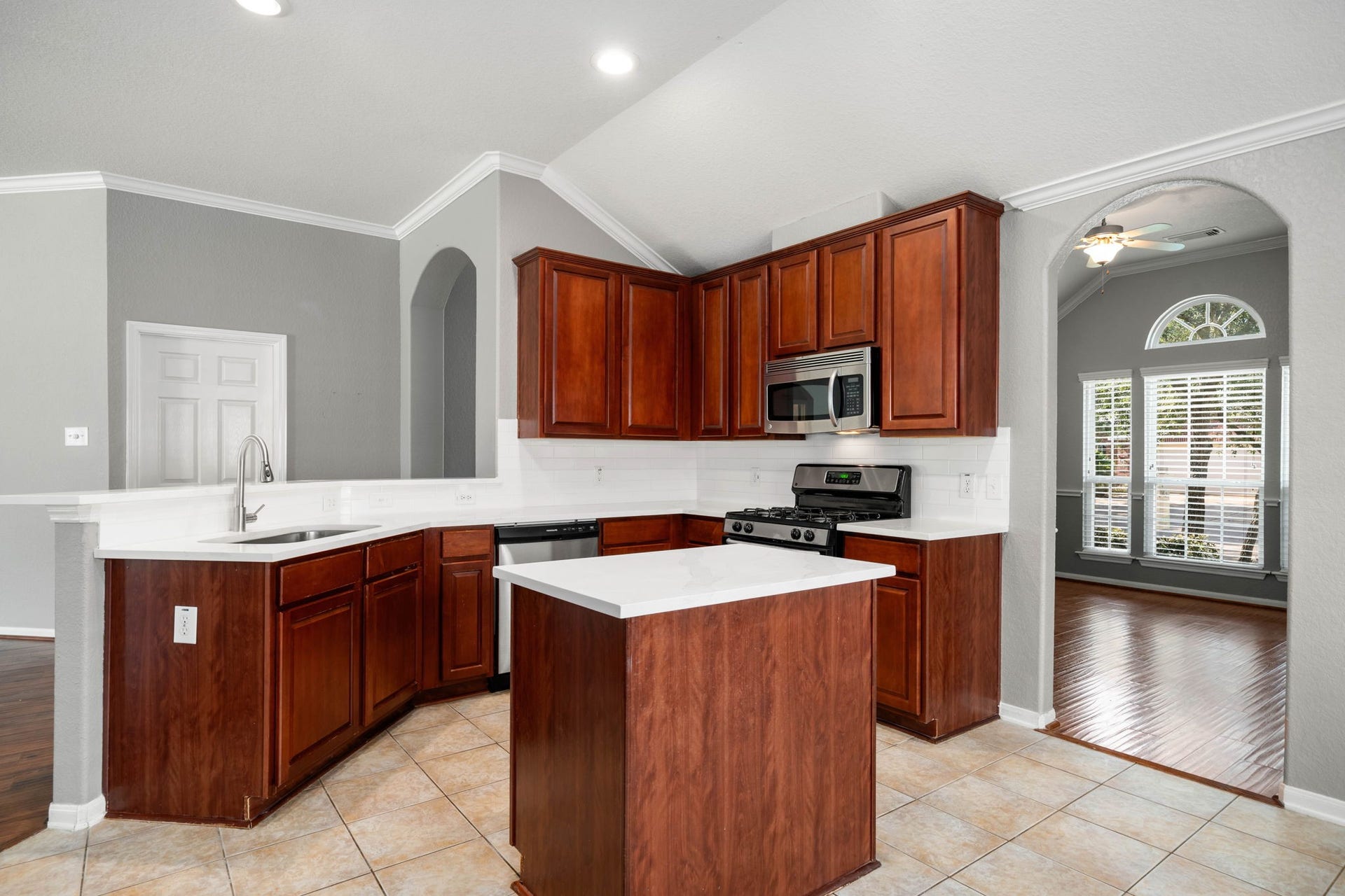 10422 Antelope Alley, Missouri City, TX 77459 This updated kitchen features new countertops, rich wood cabinetry with generous storage, and a breakfast bar that creates an easy spot for casual meals or additional prep space.