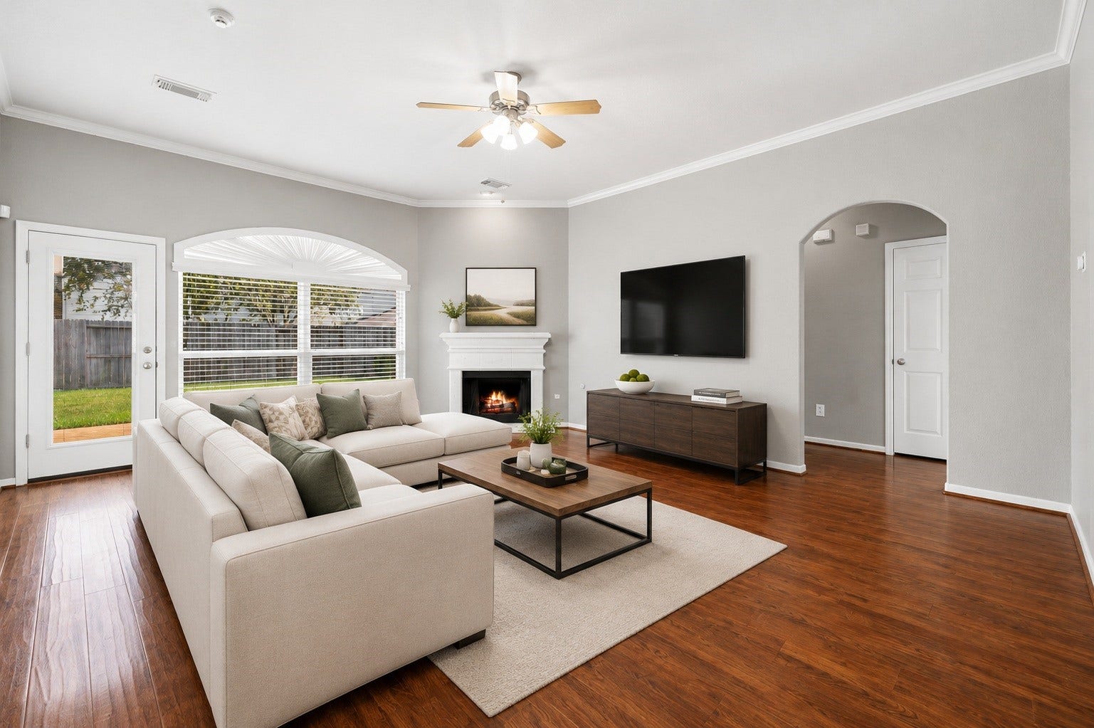 10422 Antelope Alley, Missouri City, TX 77459 The well-appointed living area offers a comfortable lifestyle with high-quality engineered wood floors and a seamless flow into the kitchen. It is a functional space designed for both relaxation and social gatherings. Virtually staged.