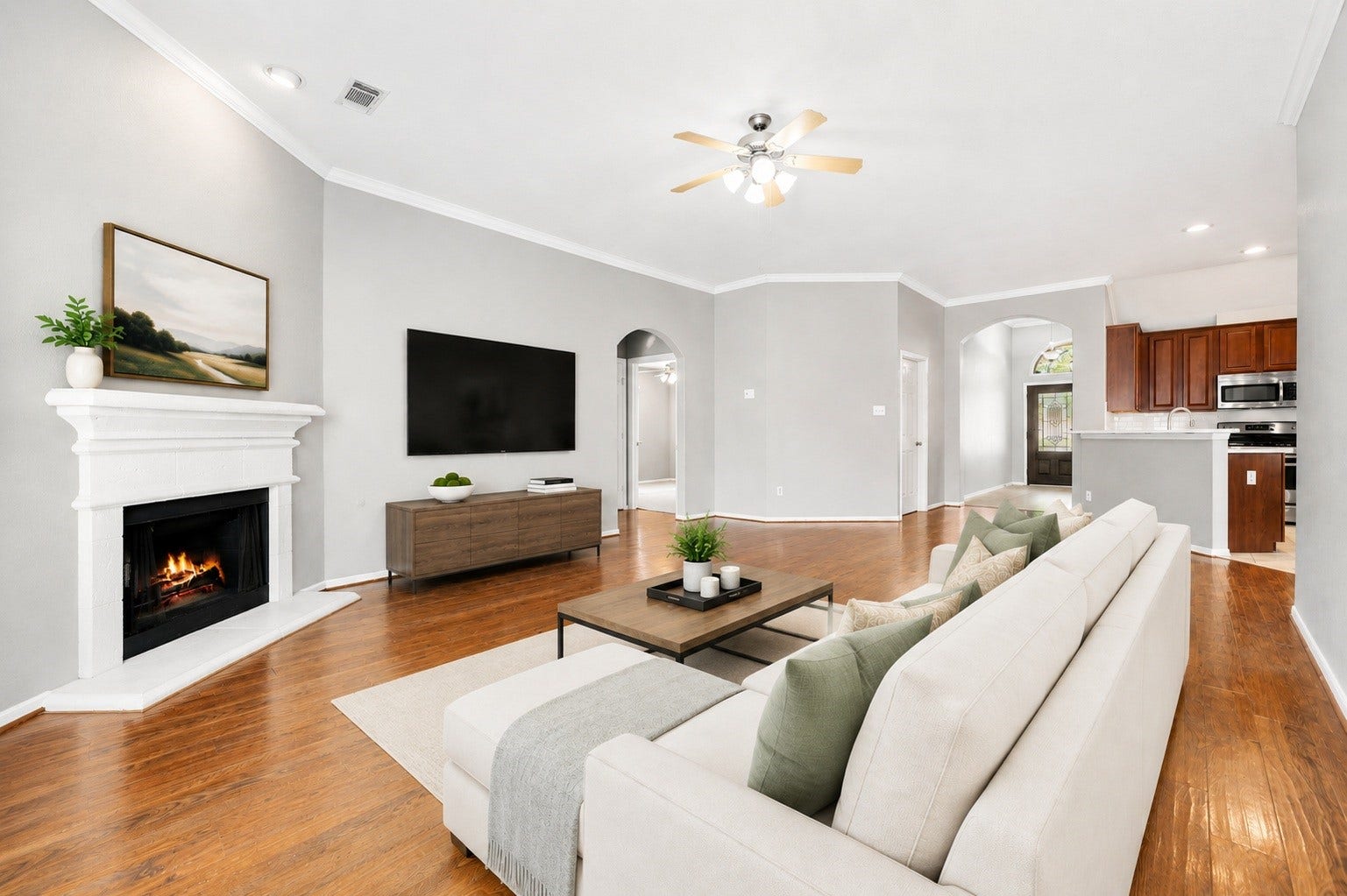 10422 Antelope Alley, Missouri City, TX 77459 This open-concept living space is bright and inviting, highlighted by a wall of windows and high ceilings. The layout is perfectly designed for easy entertaining and modern daily living. Virtually staged.