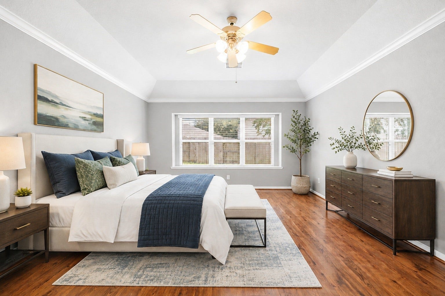 10422 Antelope Alley, Missouri City, TX 77459 A sprawling Primary Bedroom featuring high-quality engineered wood floors and a tray ceiling. This spacious sanctuary offers a peaceful environment with plenty of room for a full suite of furniture. Virtually staged.