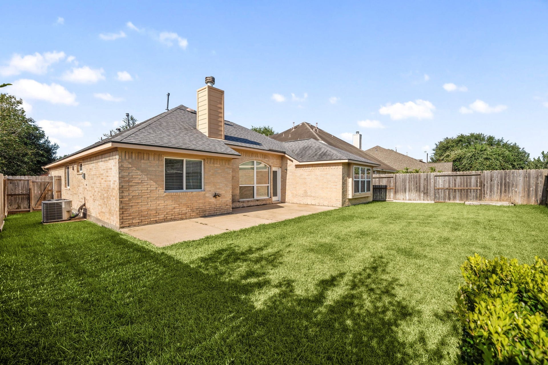10422 Antelope Alley, Missouri City, TX 77459 Enjoy relaxing afternoons on the patio overlooking the sprawling lawn. This functional outdoor space is ideal for grilling and entertaining in a quiet subdivision setting.