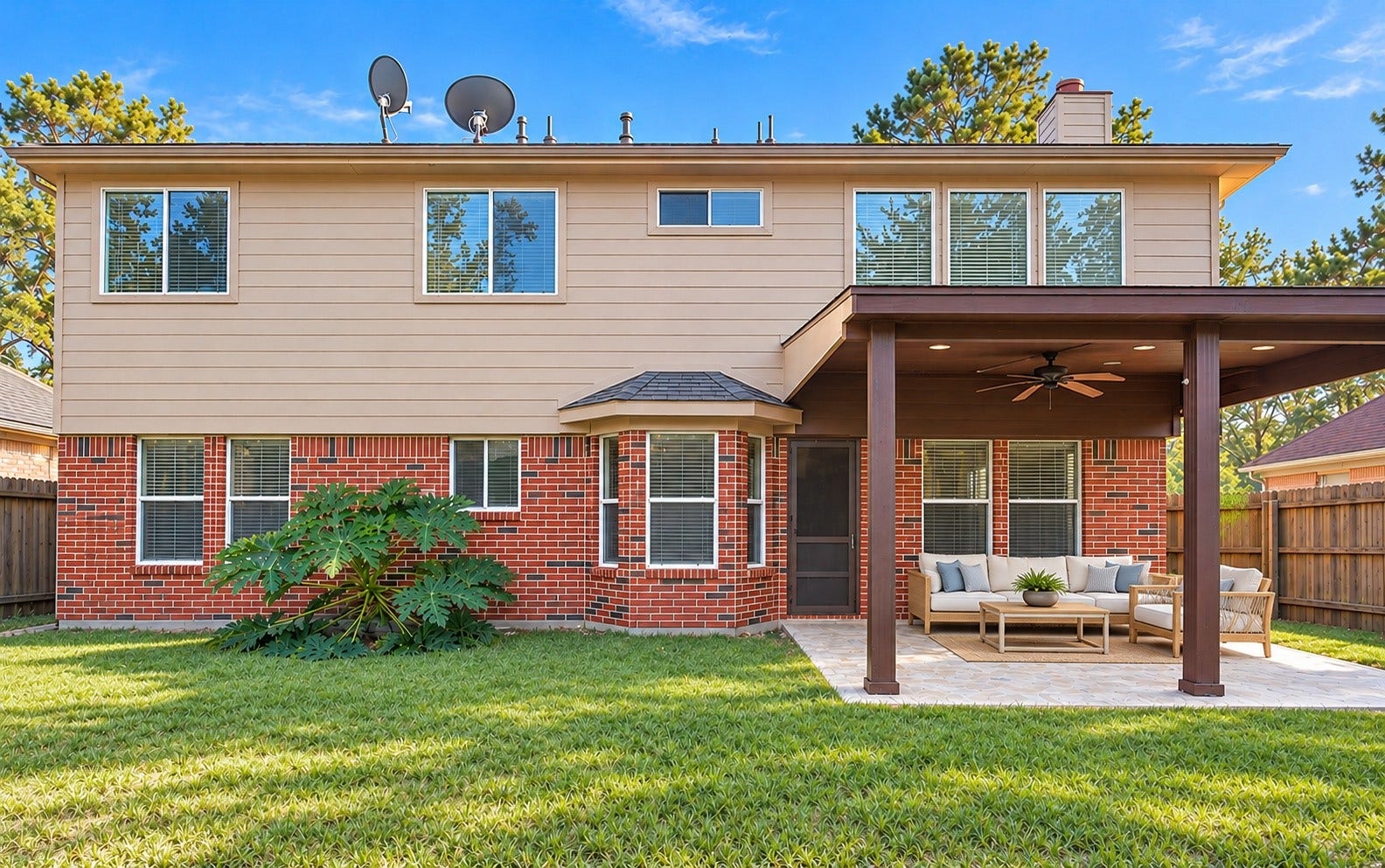 The spacious backyard with a covered patio!