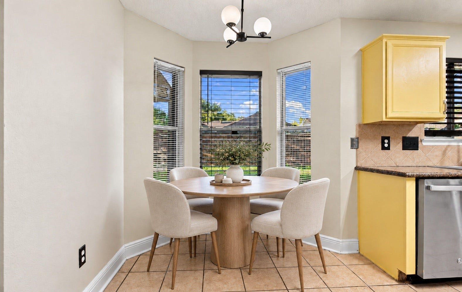 A dining area located in the kitchen with a view of the backyard!
*This photo has been virtually staged*