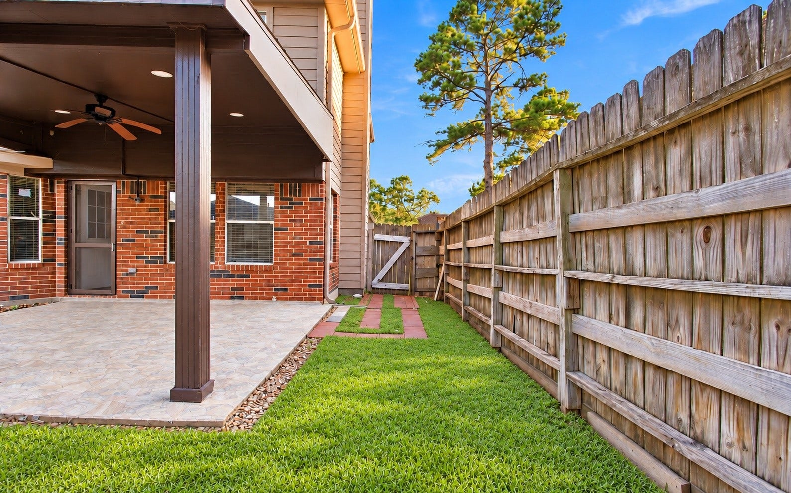 An angle of covered patio and exterior of the home
*This photo has been virtually staged*