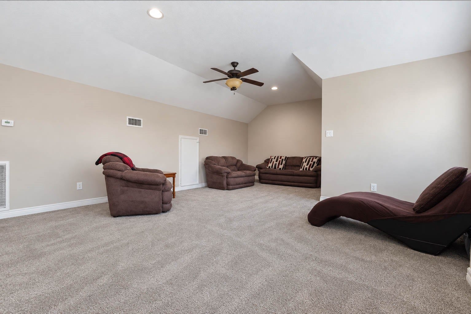 33103 Whickham Circle, Fulshear, TX 77441 Generous dimensions continue throughout the game room, providing ample room for oversized furnishings and multiple functional zones. High ceilings and soft carpeting enhance the comfort and spaciousness of this upper-level retreat.