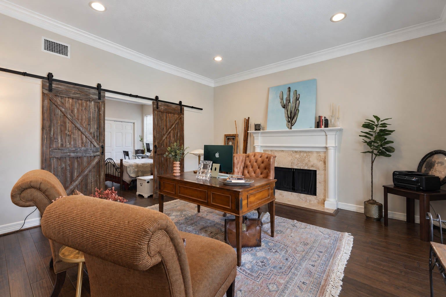 33103 Whickham Circle, Fulshear, TX 77441 Positioned opposite the formal dining room just off the entry, this sophisticated formal living room, currently used as an office, features hardwood flooring, elegant crown molding, recessed lighting, & a traditional fireplace. Generous wall space and a flexible layout allow the room to easily adapt to your needs.