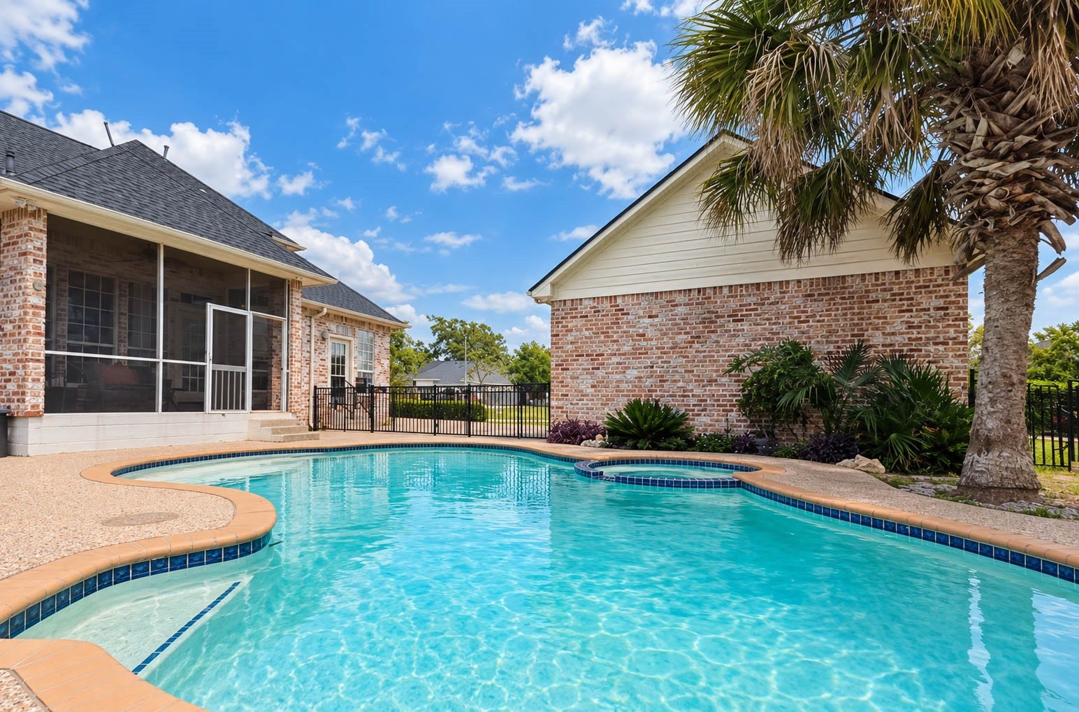 33103 Whickham Circle, Fulshear, TX 77441 A second poolside perspective showcases the generous swimming area, curved pool design, and expansive surrounding deck.