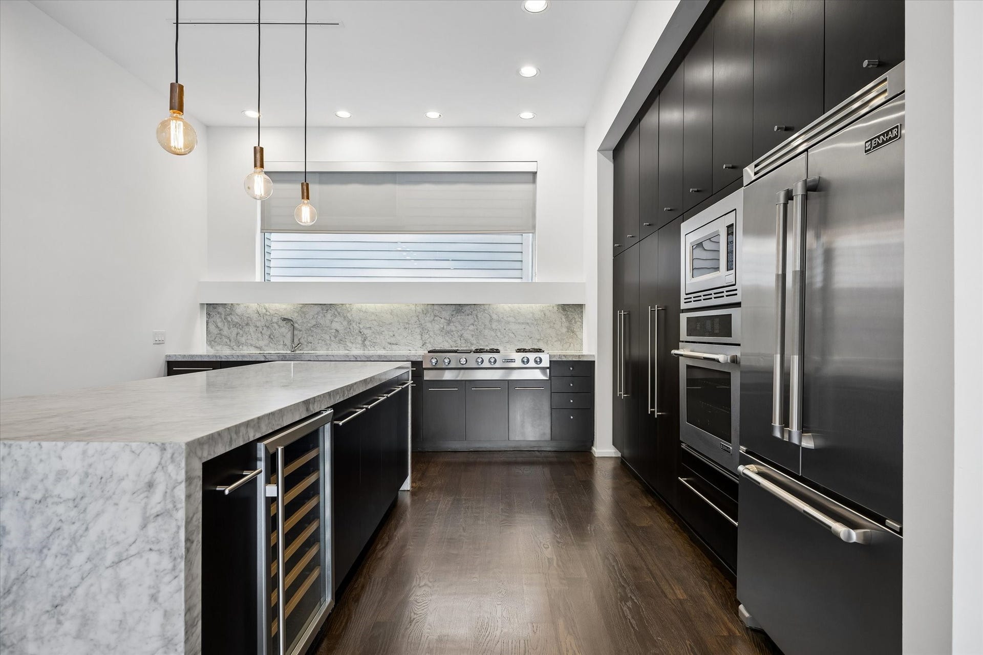 4309 Lillian Street, Houston, TX 77007 The kitchen features high-end stainless appliances including a Jenn-Air refrigerator, wall oven and microwave and gas cooktop. There is also a wine refrigerator that is included!