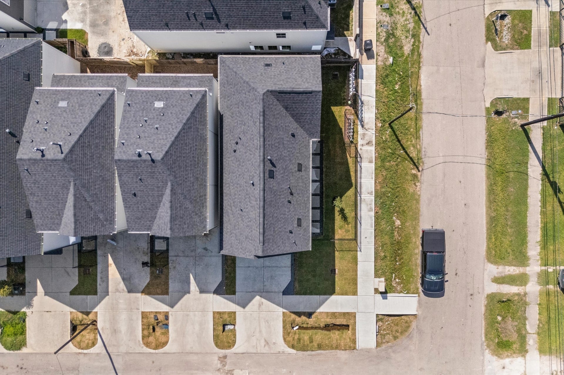 This stunning aerial view highlights the communitys prime location, showcasing surrounding streets, nearby amenities, and the neighborhoods layout, giving a clear perspective of the homes setting and its convenient, connected surroundings.
