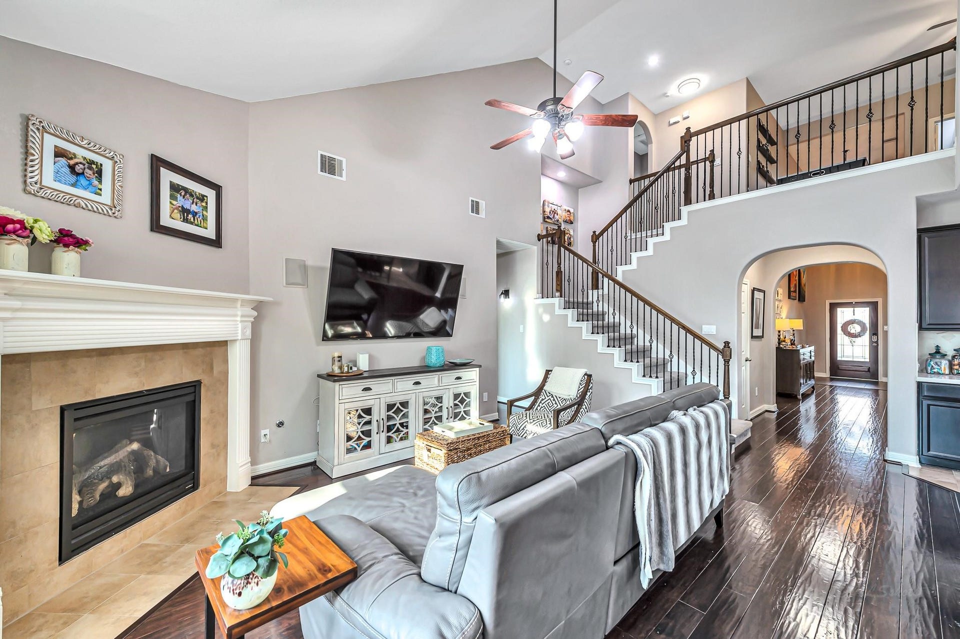 11618 Via Verdone Drive, Richmond, TX 77406 Living area includes gas fireplace and surround sound speakers installed in ceiling
