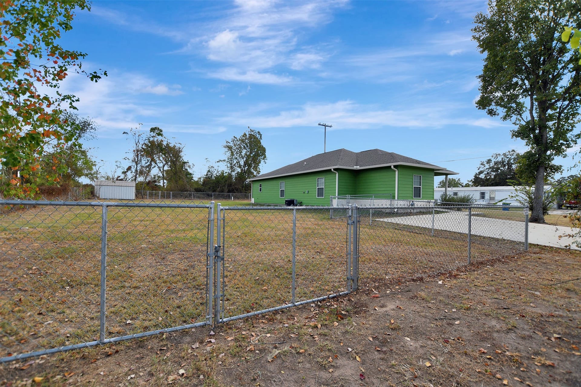 2546 16th Street, Hempstead, TX 77445 Fenced yard offering plenty of open space for outdoor activities or potential landscaping projects.