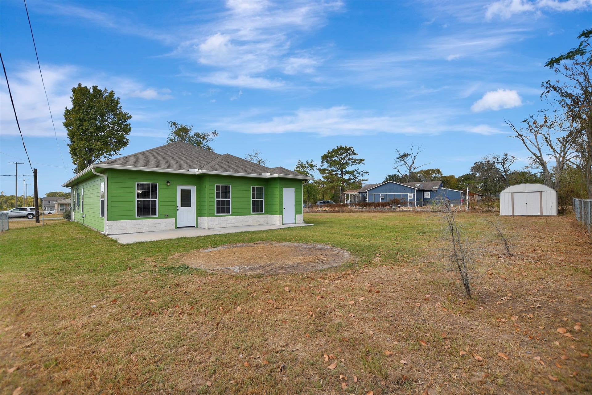 2546 16th Street, Hempstead, TX 77445 Home features a sizeable yard and an external storage shed. The property offers ample outdoor space.