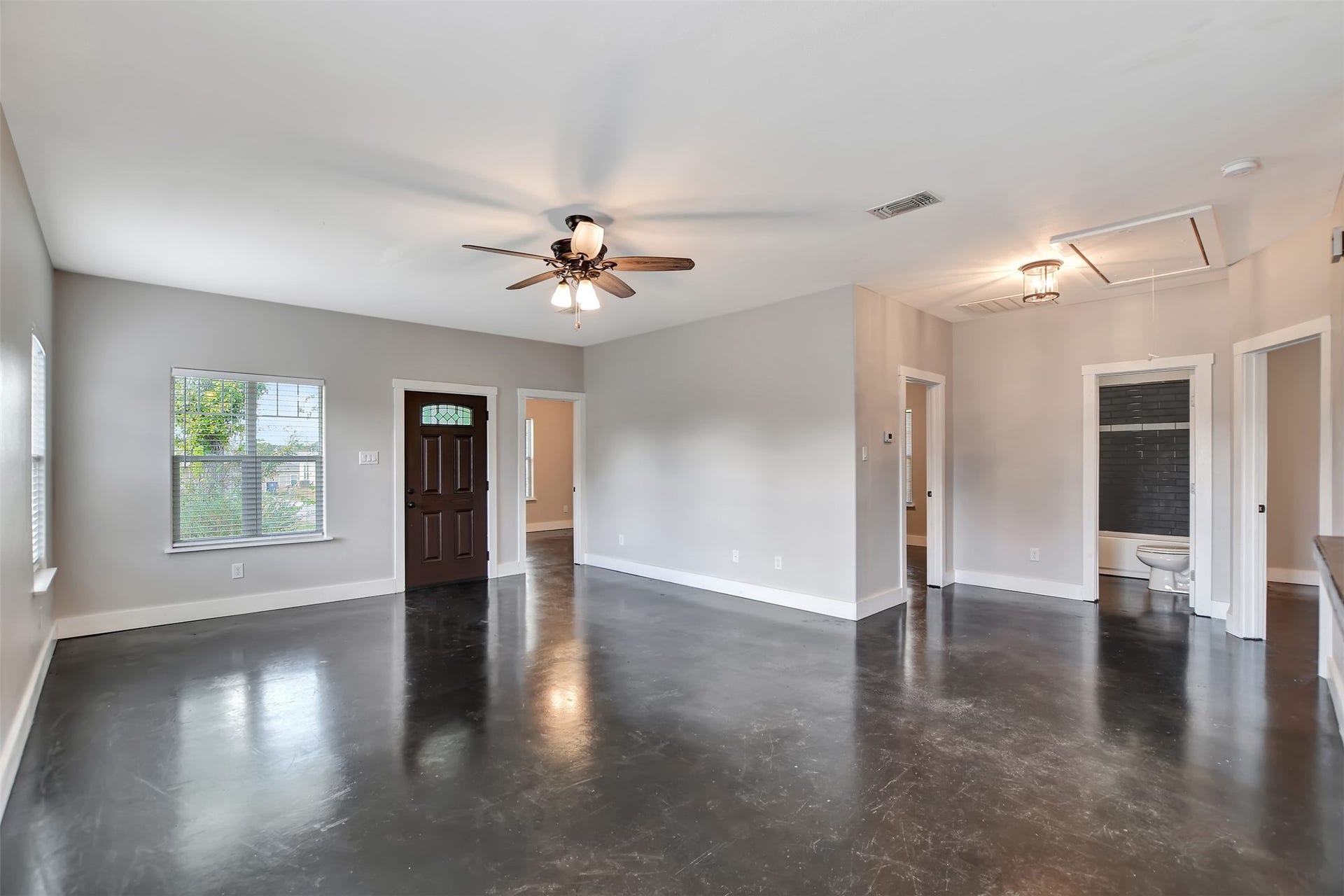2546 16th Street, Hempstead, TX 77445 Living room with one bedroom at the front and a small area leading into 2 other secondary bedrooms & the guest bathroom.