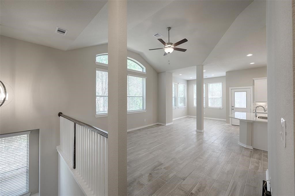 115 Handley Drive, Montgomery, TX 77316 High ceilings. Walls of windows. Wood look tile floors.