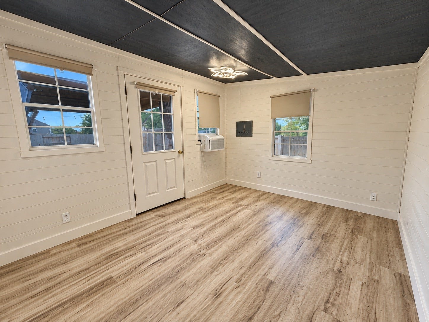 This 10' x 12' shed is fully finished and features a window unit, making it an ideal space for a hobby room, home office, or private media room.