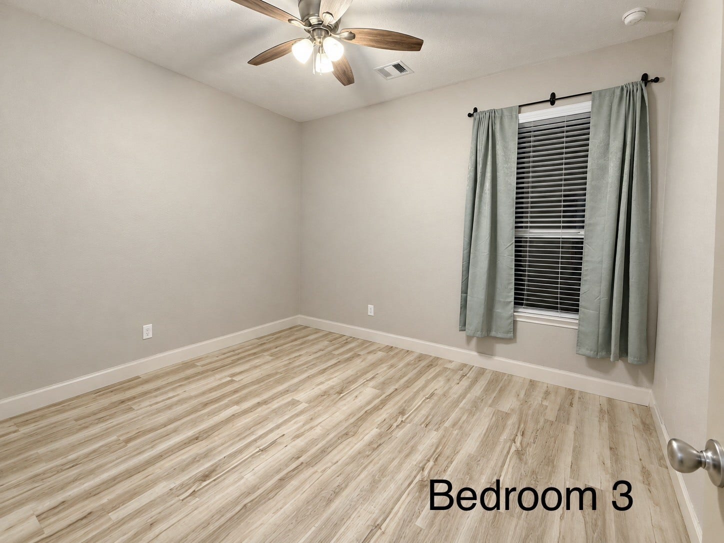 Spacious and sunlit, this final bedroom serves as a versatile retreat, featuring generous sized windows that provide an airy atmosphere and ample natural light.