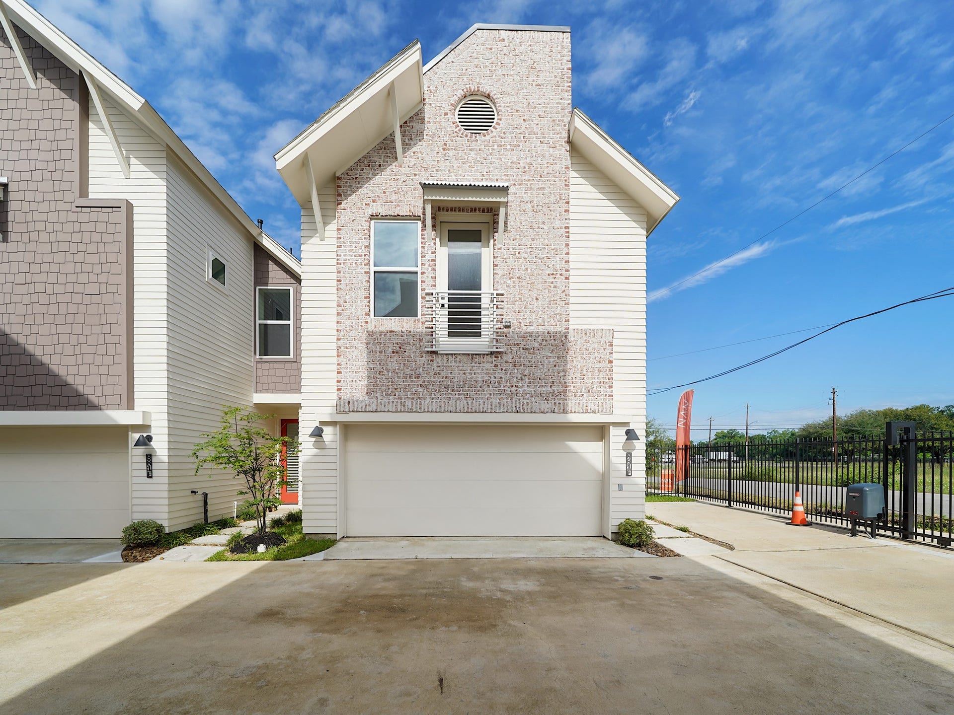 881 Rachel Street, #A, Houston, TX 77091 This modern townhouse features a two-car garage, brick and siding exterior, and a small landscaped area. It's part of a well-maintained complex with a gated entrance, offering both security and convenience.
Photo Disclaimer: Photos are representative of the community and may depict a similar floor plan, model home, or previously completed residence.