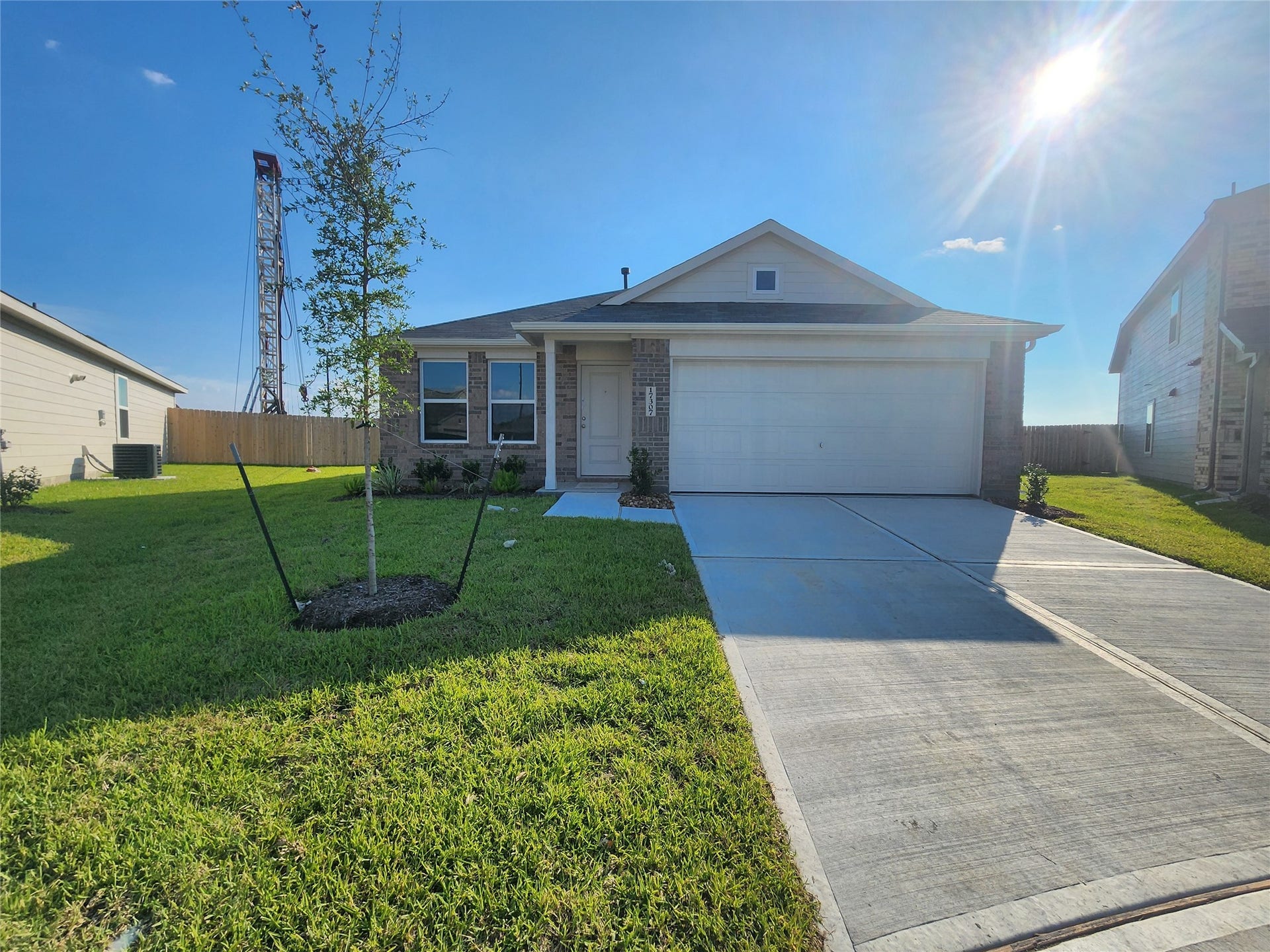 17307 Adina Creek Court, Crosby, TX 77532 Single-story, brick modern home with a two-car garage situated on a cul-de-sac.