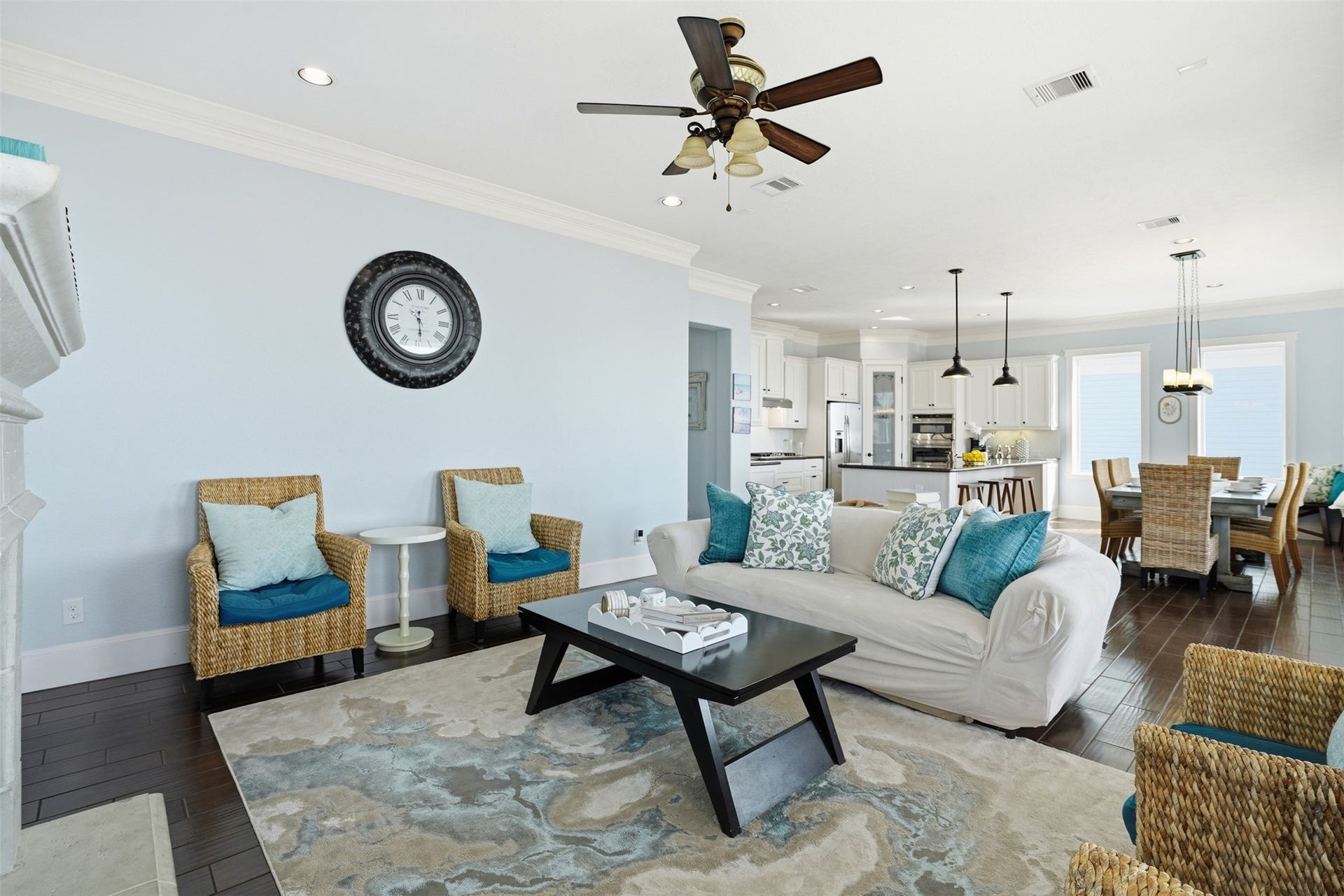 11622 Beachside, Galveston, TX 77554 This cozy living room features a welcoming fireplace, and built-in cabinets.
