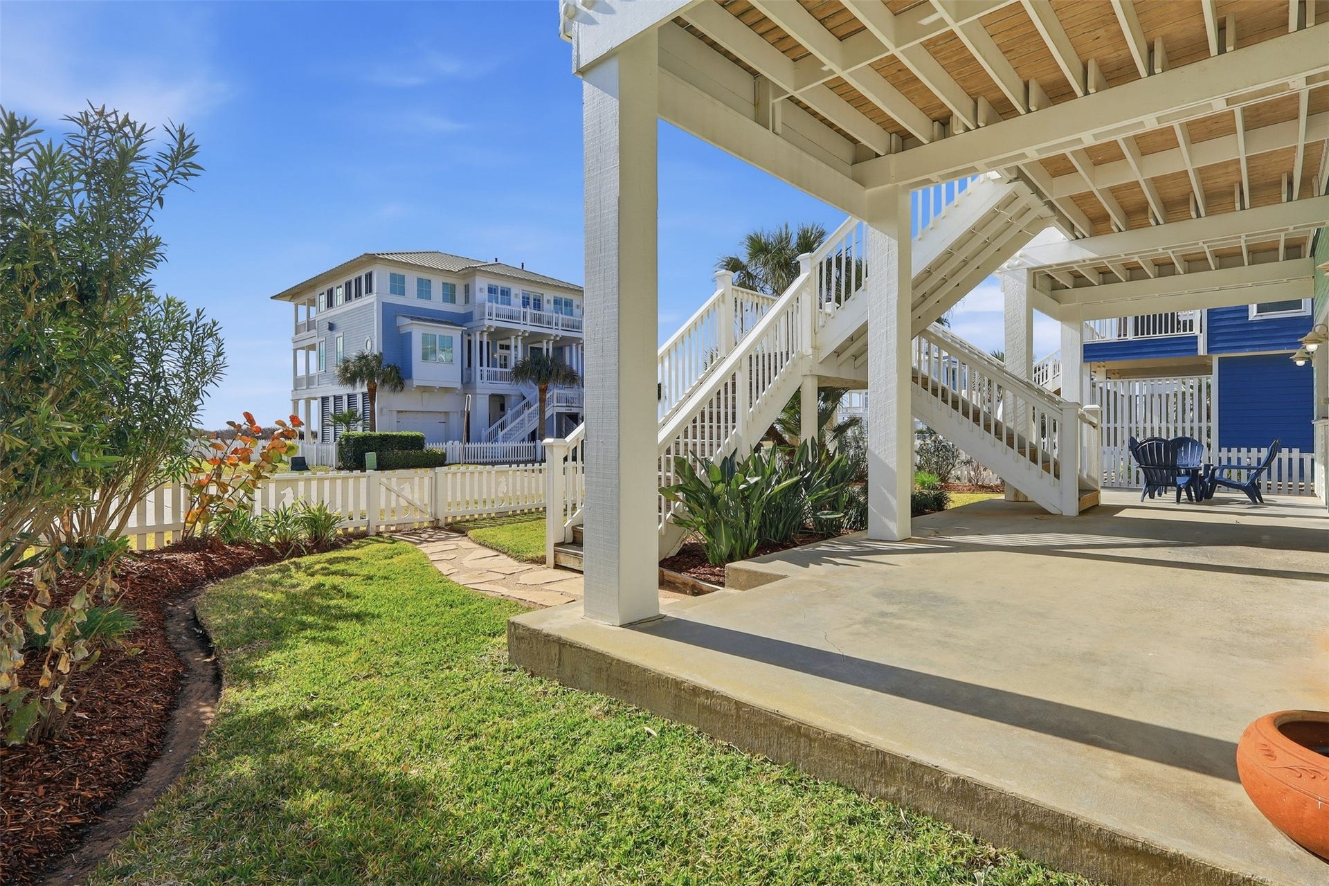 11622 Beachside, Galveston, TX 77554 Charming outdoor space featuring a covered patio with stairs leading to the porch and front door.