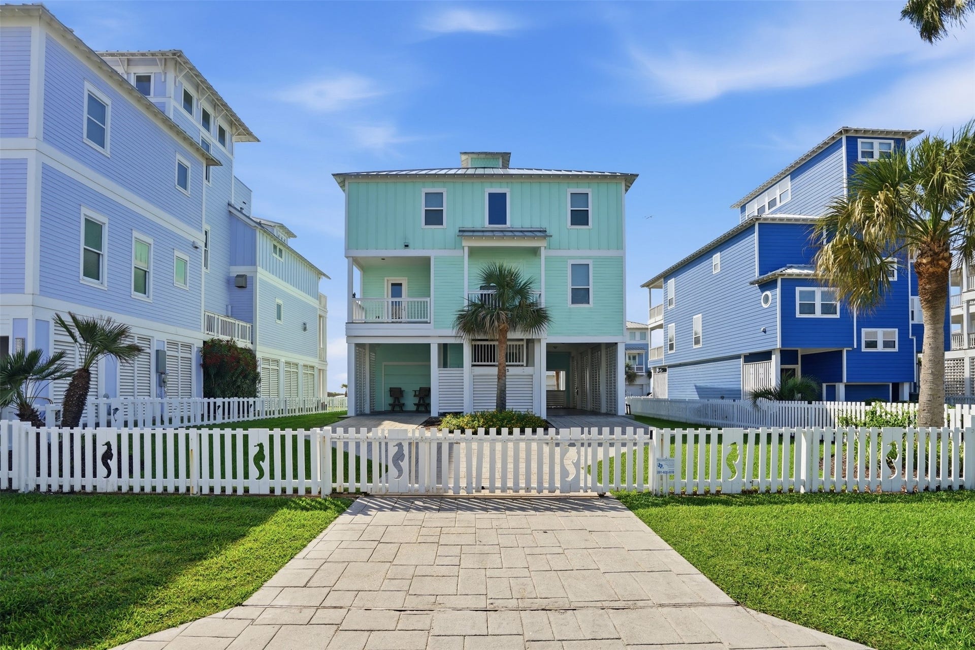 11622 Beachside, Galveston, TX 77554 The gated driveway closes to create a fully enclosed yard, offering added privacy, security, and space to enjoy outdoor living.