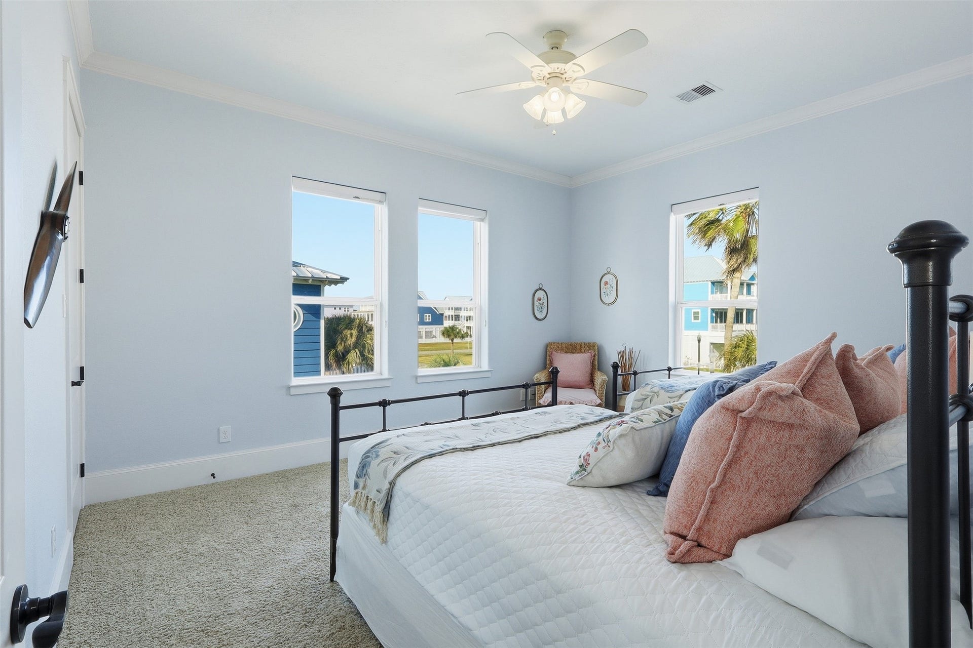 11622 Beachside, Galveston, TX 77554 This bright bedroom features ample natural light from three windows. The room offers a serene and airy atmosphere with a nice view outside.