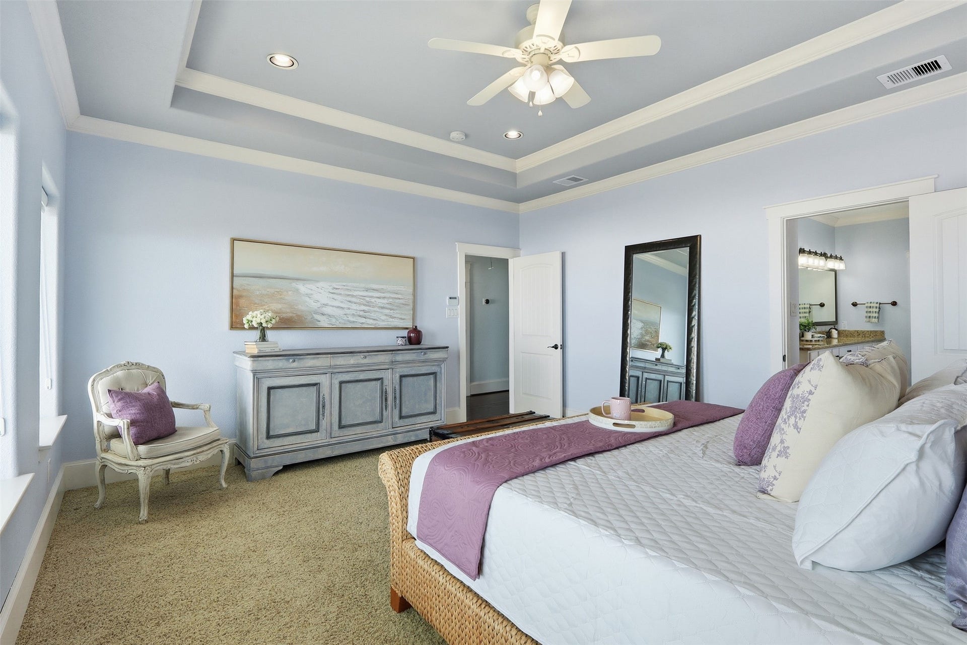 11622 Beachside, Galveston, TX 77554 The primary bedroom offers tray ceiling with recessed lighting and large windows for natural light.