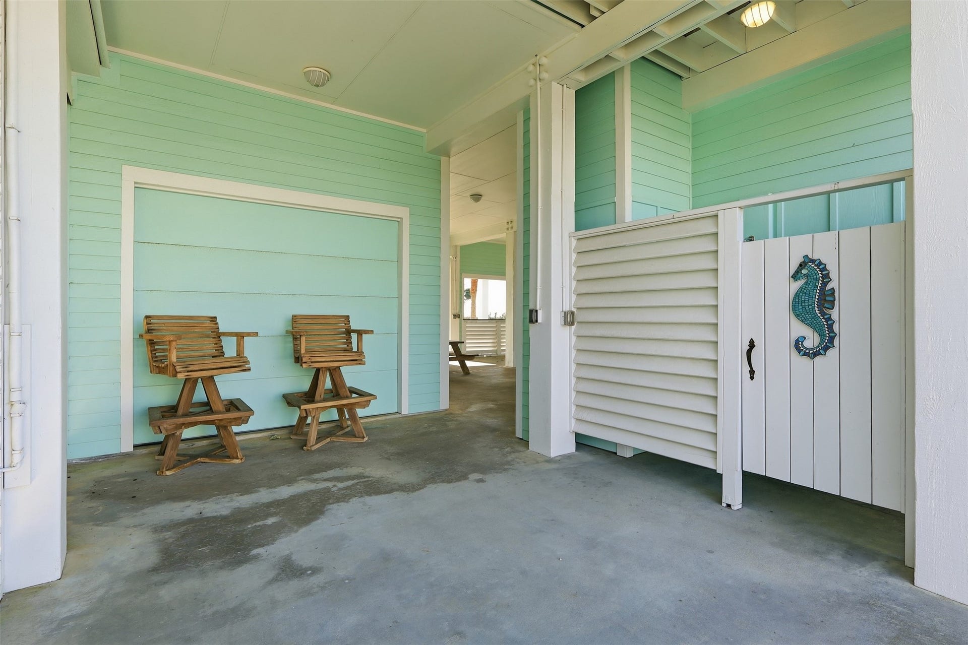 11622 Beachside, Galveston, TX 77554 A charming covered patio area with an outdoor shower.