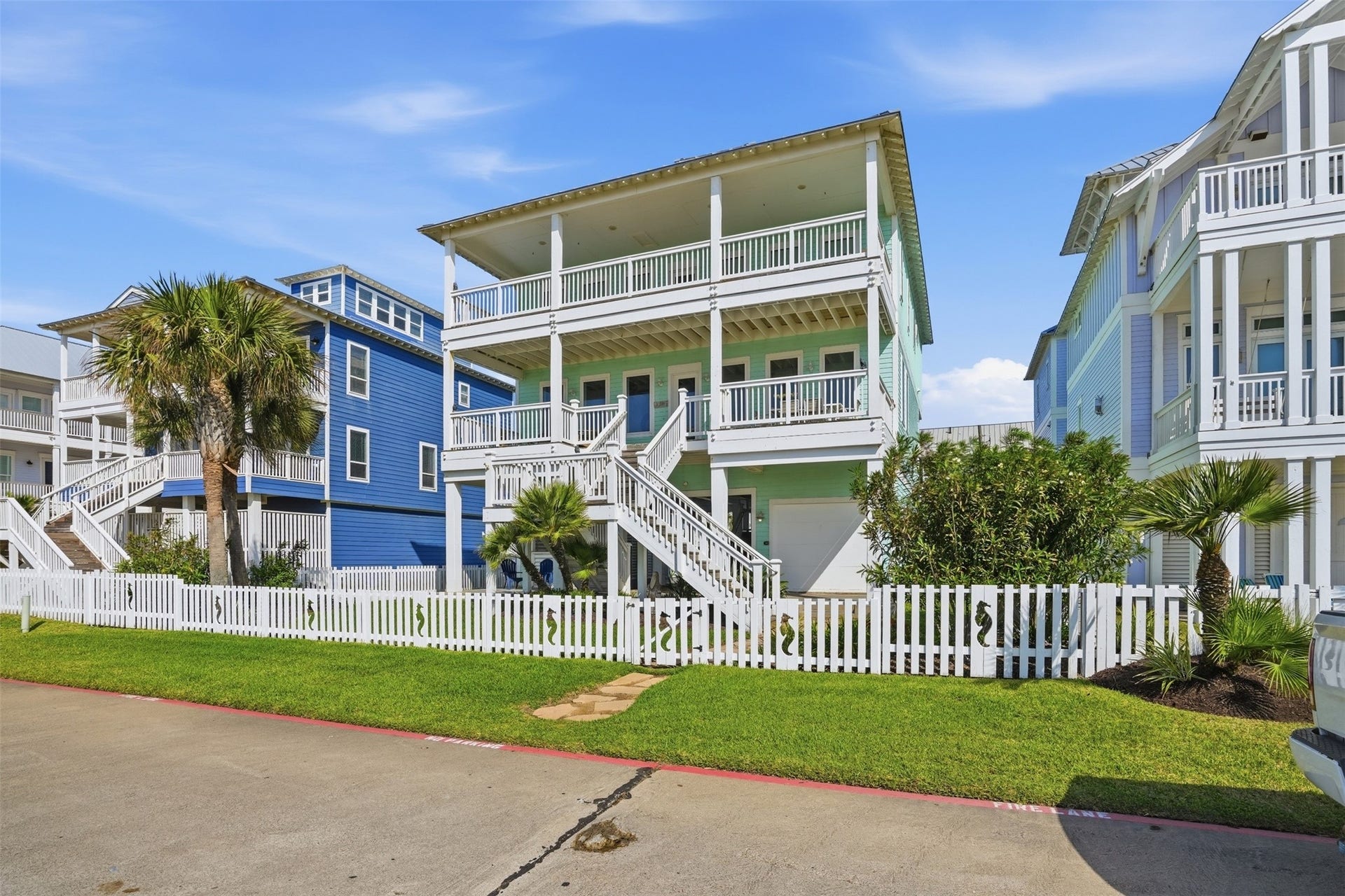11622 Beachside, Galveston, TX 77554 The fully fenced front yard offers privacy and peace of mind, with a convenient gate providing direct access to the beach just across the way.