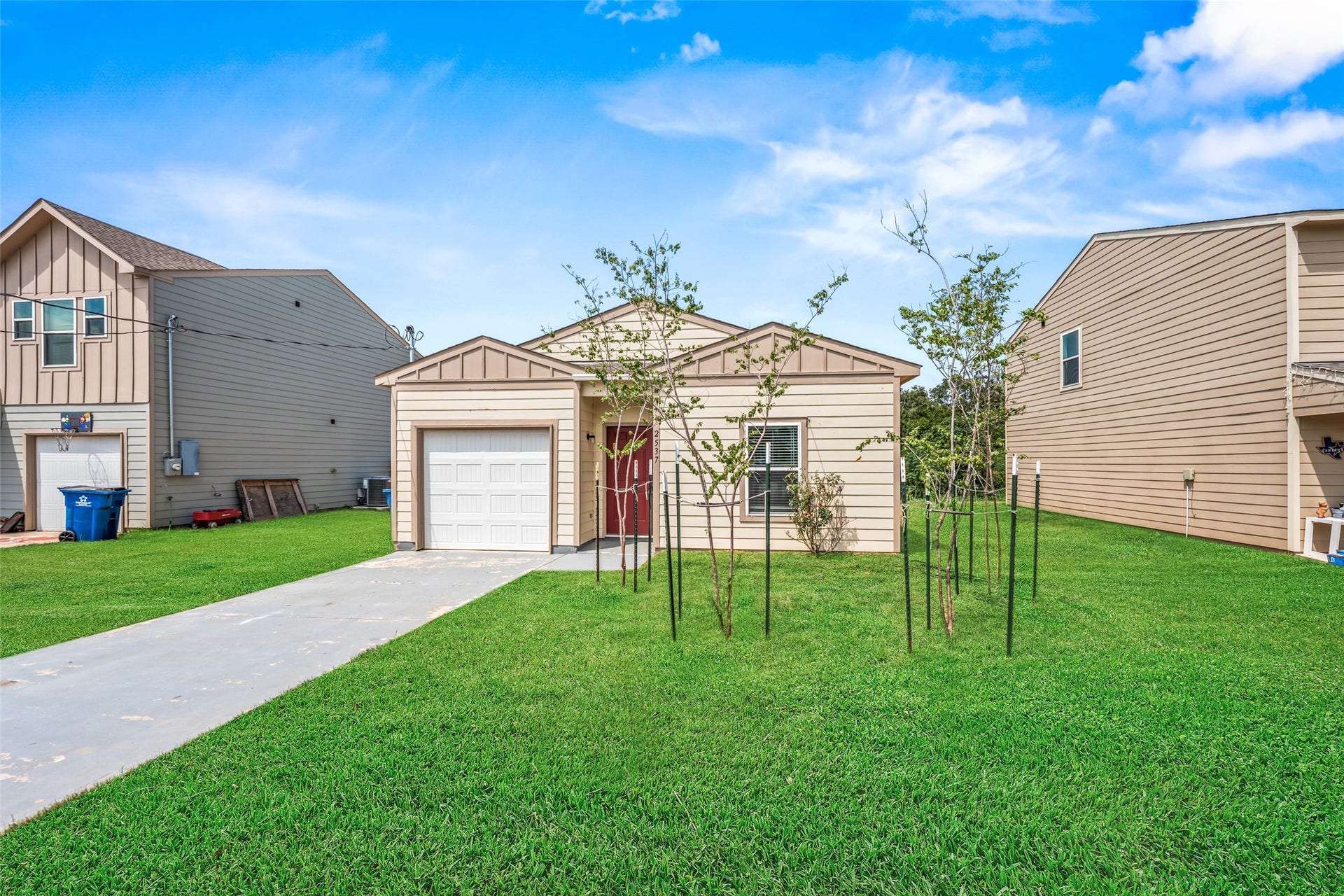 2537 18th Street, Hempstead, TX 77445 Front exterior view showcasing the single-story home with brick and stone accents, attached garage, covered entry, and manicured lawn.